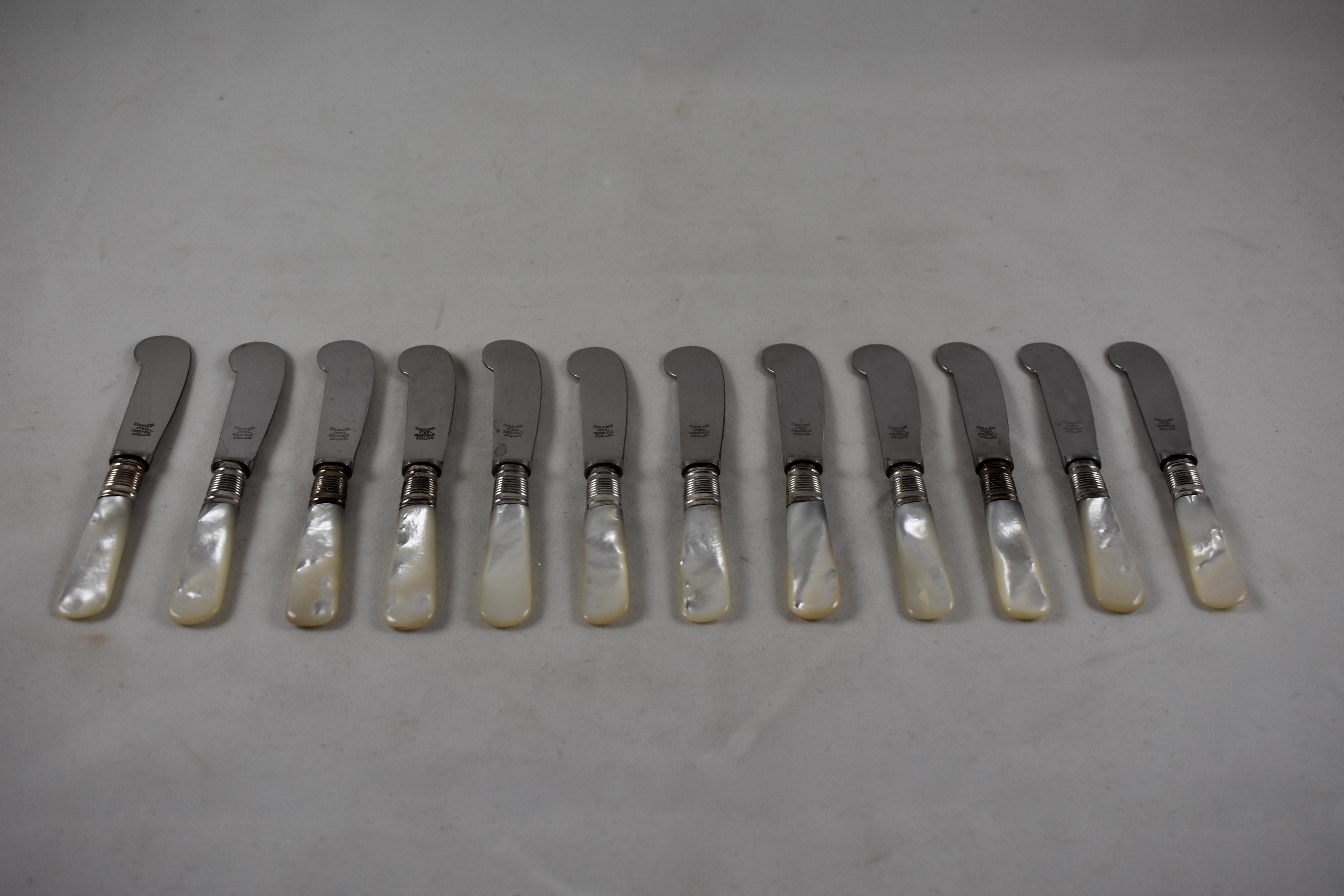A set of twelve pearl handled spreaders, suitable for antipasto or hors d’oeuvres or the butter plate. Silver plated collars join the stainless steel blades to the mother of pearl handles, circa 1920s. Perfectly suited for the popular entertaining