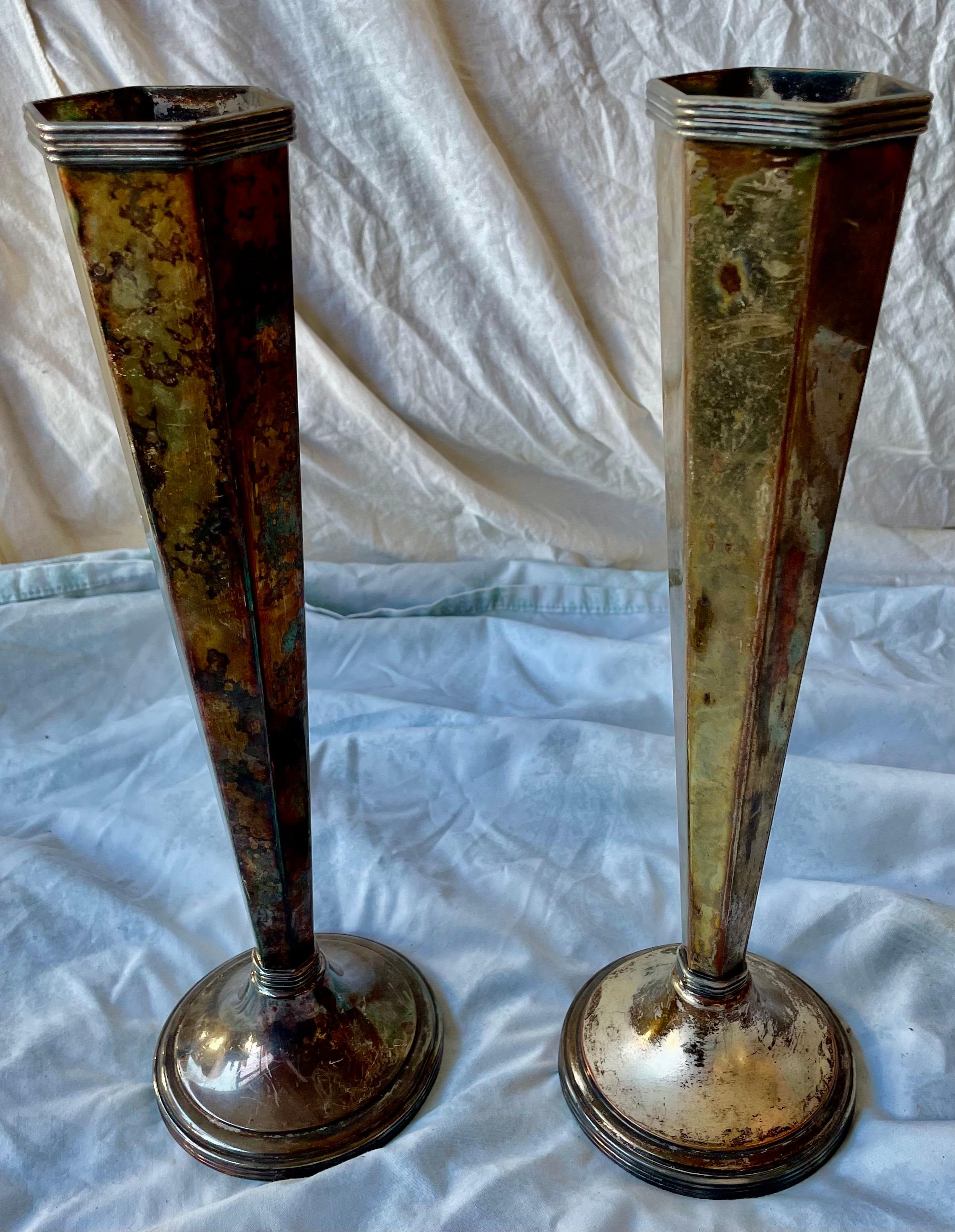 This is a wonderful pair of Sheffield silver plate vases that have an amazing vintage or antique finish that can only be created by age. The finish is mostly tarnish but there are also silver losses where the copper beneath is visible so these will