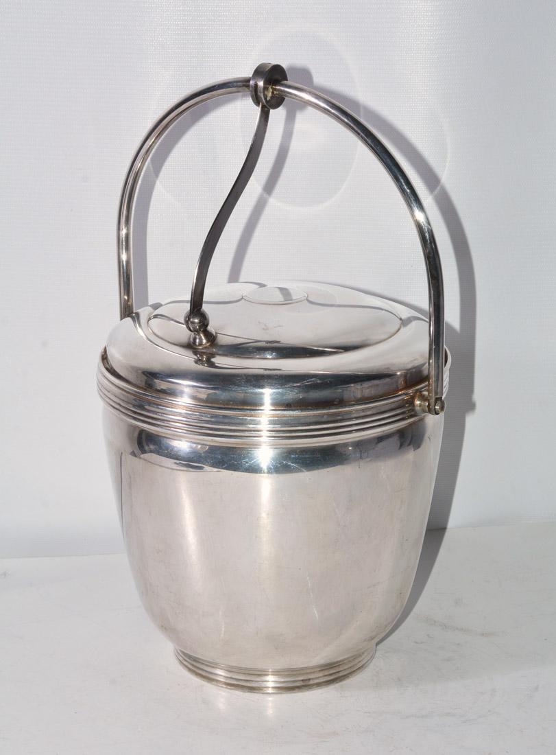 Lidded and handled ice bucket with glass insert, marked underside for The Sheffield Silver Company, Made in USA, holiday accessory, tableware, bar ware, Measures to handle top 13 inches, 9 inch diameter.