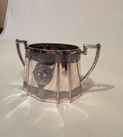 Sheffield triptych consisting of 'Walker & Hall' teapot, sugar bowl and milk jug