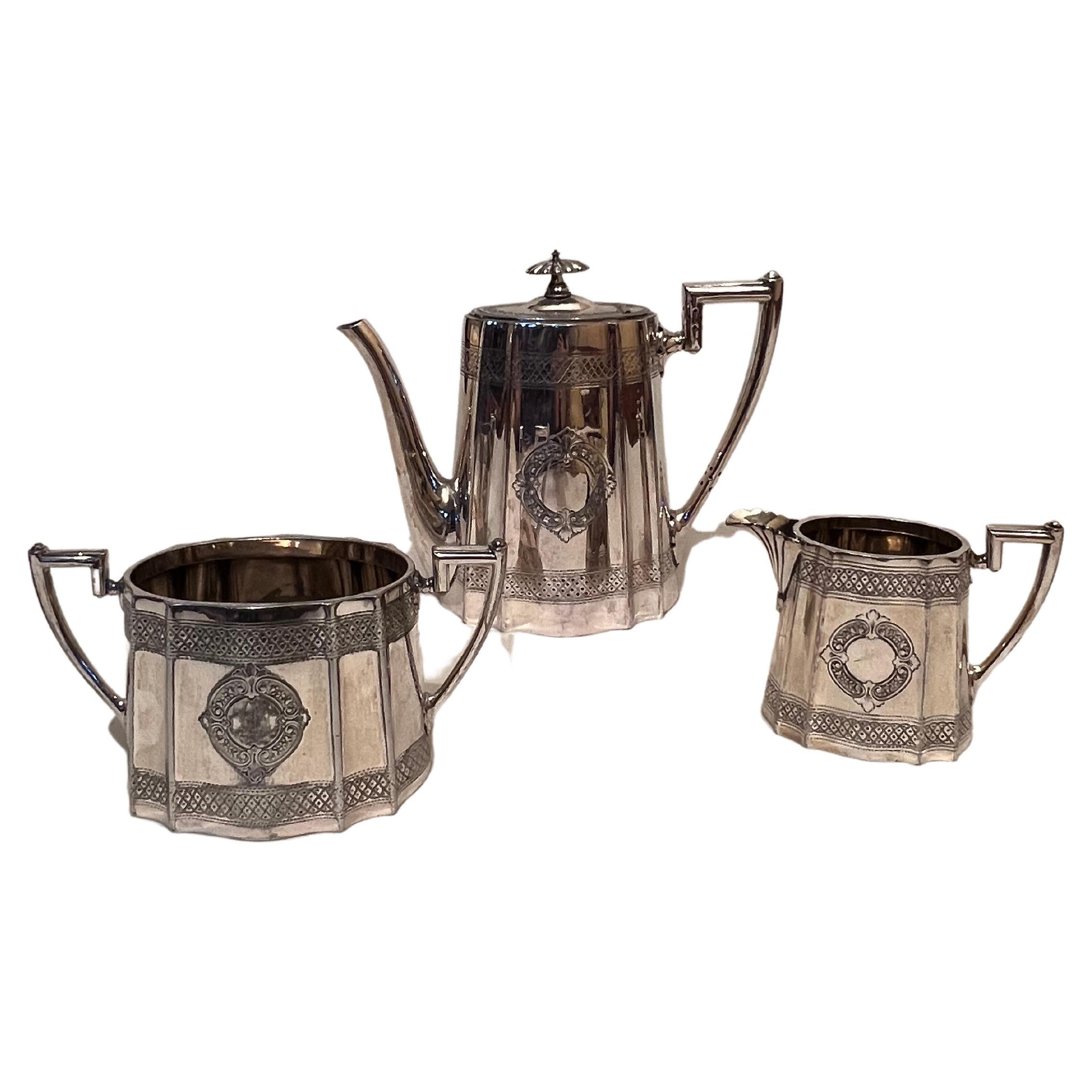 Sheffield triptych consisting of 'Walker & Hall' teapot, sugar bowl and milk jug For Sale