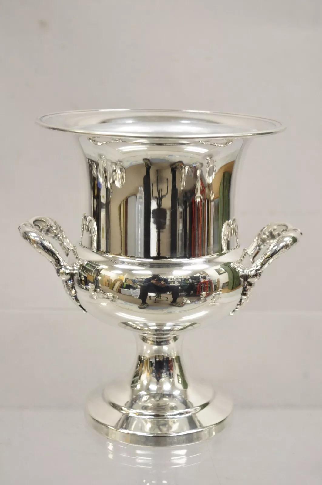  Vintage Sheffield USA Silver Plated Ornate Twin Handle Champagne Chiller Ice Bucket With Metal Liner. Circa Mid 20th Century. Measurements: 9.5
