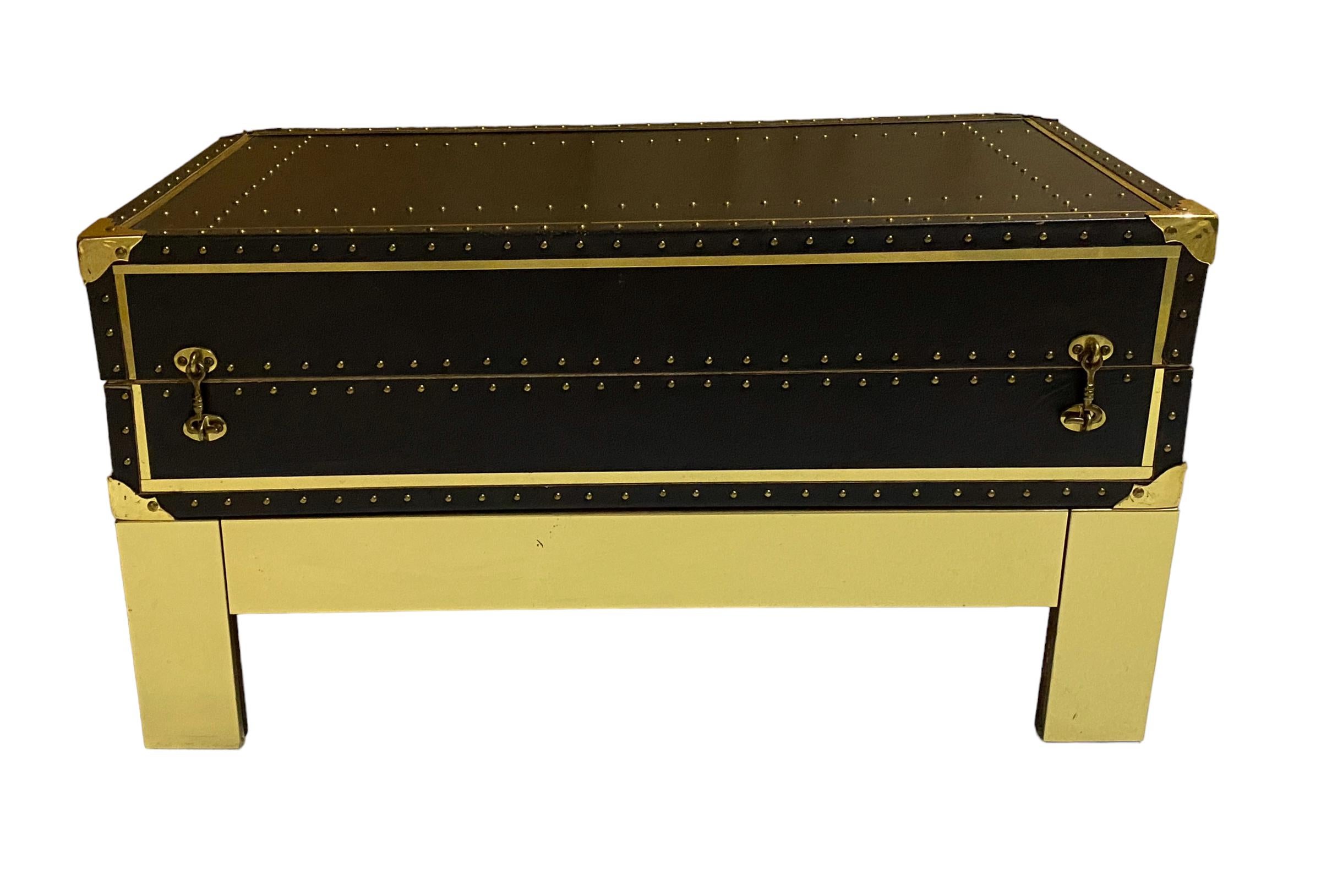 Sheik Campaign Style 1970s Brass Studded Leather Trunk on Brass Stand 
USA, circa 1970s

Immerse your living space with this  1970s exquisite Sheik Campaign Style Brass Studded Leather Trunk on  Stand. Made in the USA, this visually stunning piece