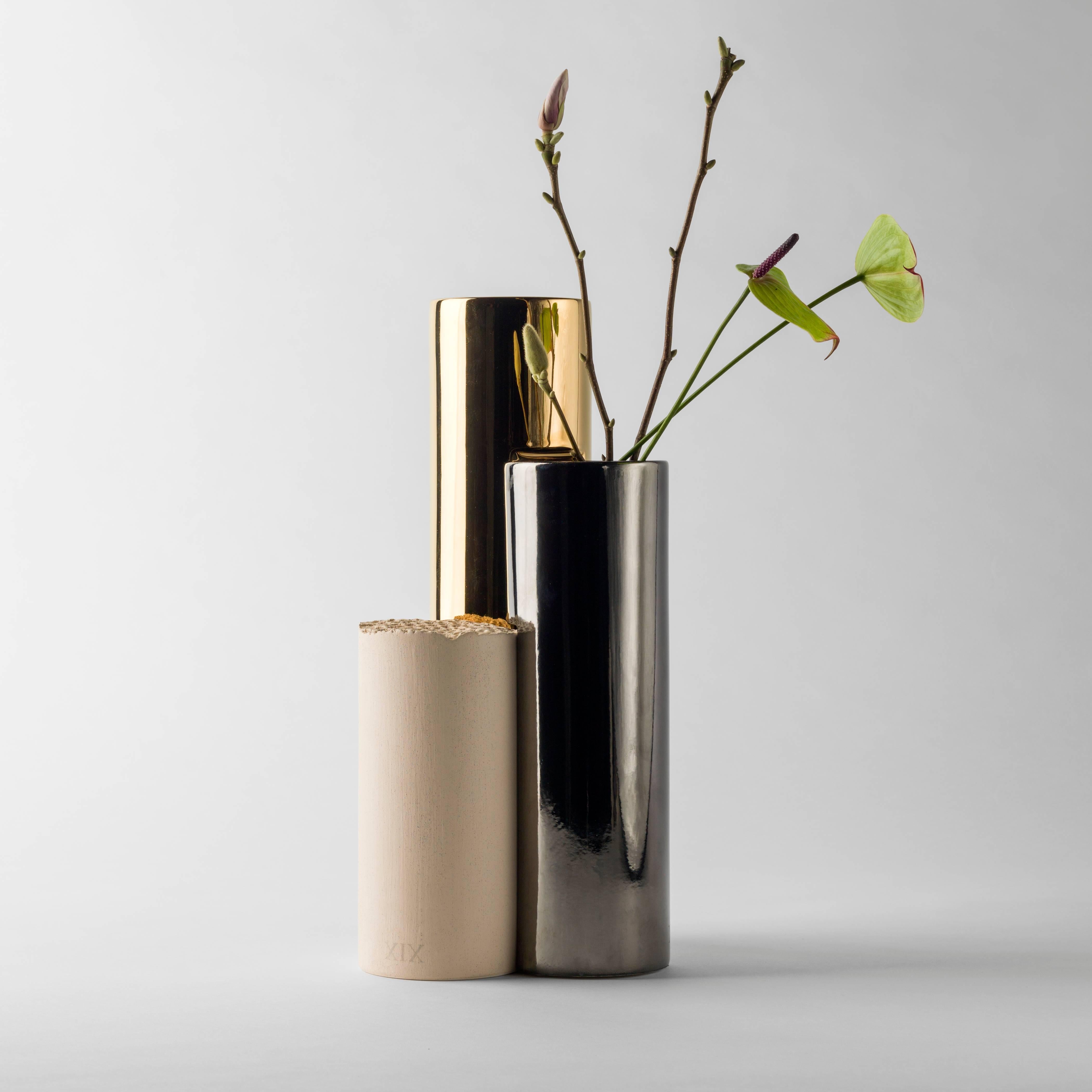 Is-Dher vases design by Sheikha Hind Bint Majid Al Qassimi.

24-carat gold-plated enameled ceramic vase, platinum and a beige engobe. 

Limited edition of eight units and two artist proofs and two prototypes.

Measure: 19 x 18 x 40 H