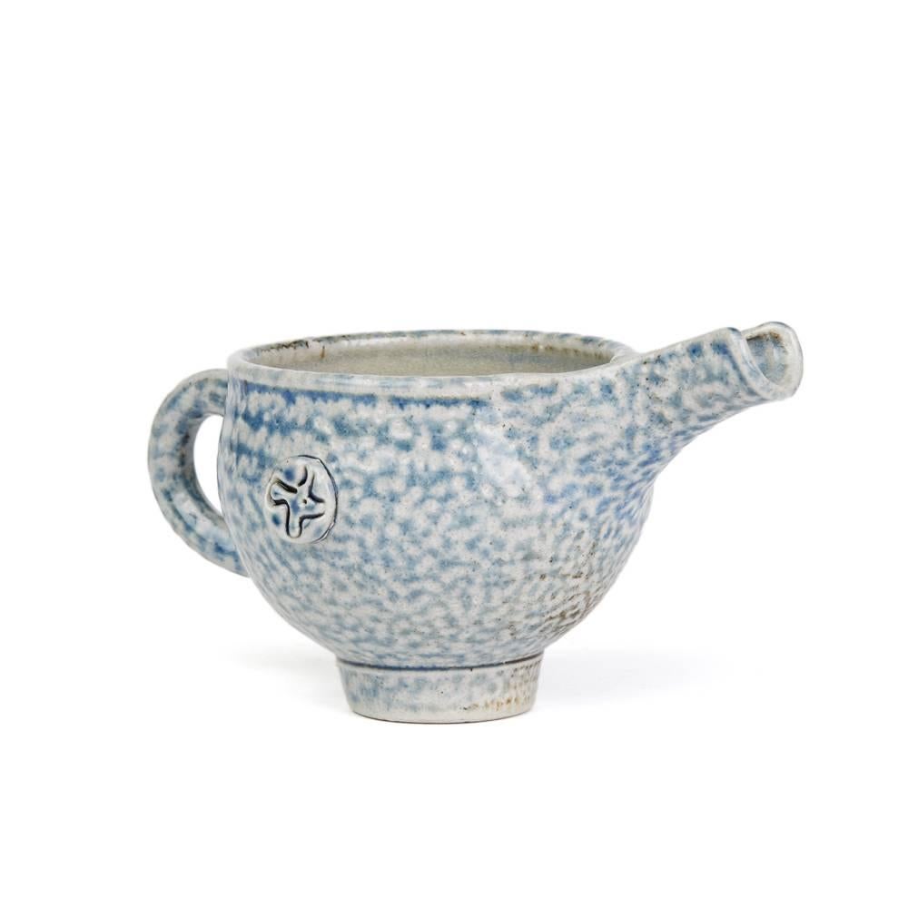 A stunning vintage British studio pottery dish by renowned potter Sheila Casson and made in Ross-on-Wye. This stylish rounded bulbous stoneware jug stands on a narrow rounded foot with loop handle and with a raised deep channeled pouring spout. The