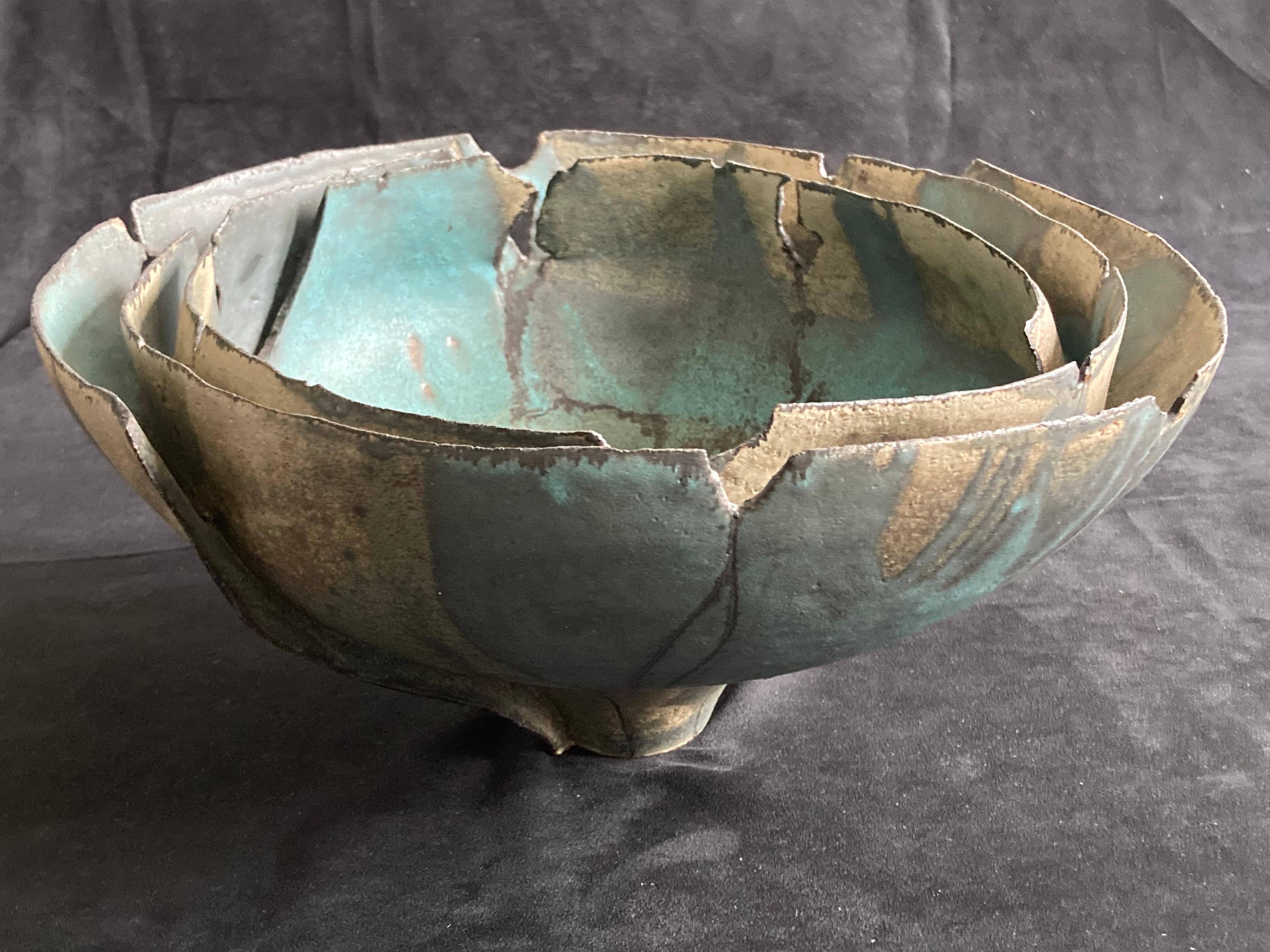 Sheila Fournier (British 1930-2000), large studio pottery bowl.

Hand built multi layered with green and grey running glazes.

Artist studio stamp under.

Sheila Fournier married Robert Charles Privet Fournier in 1961. She
was trained as a