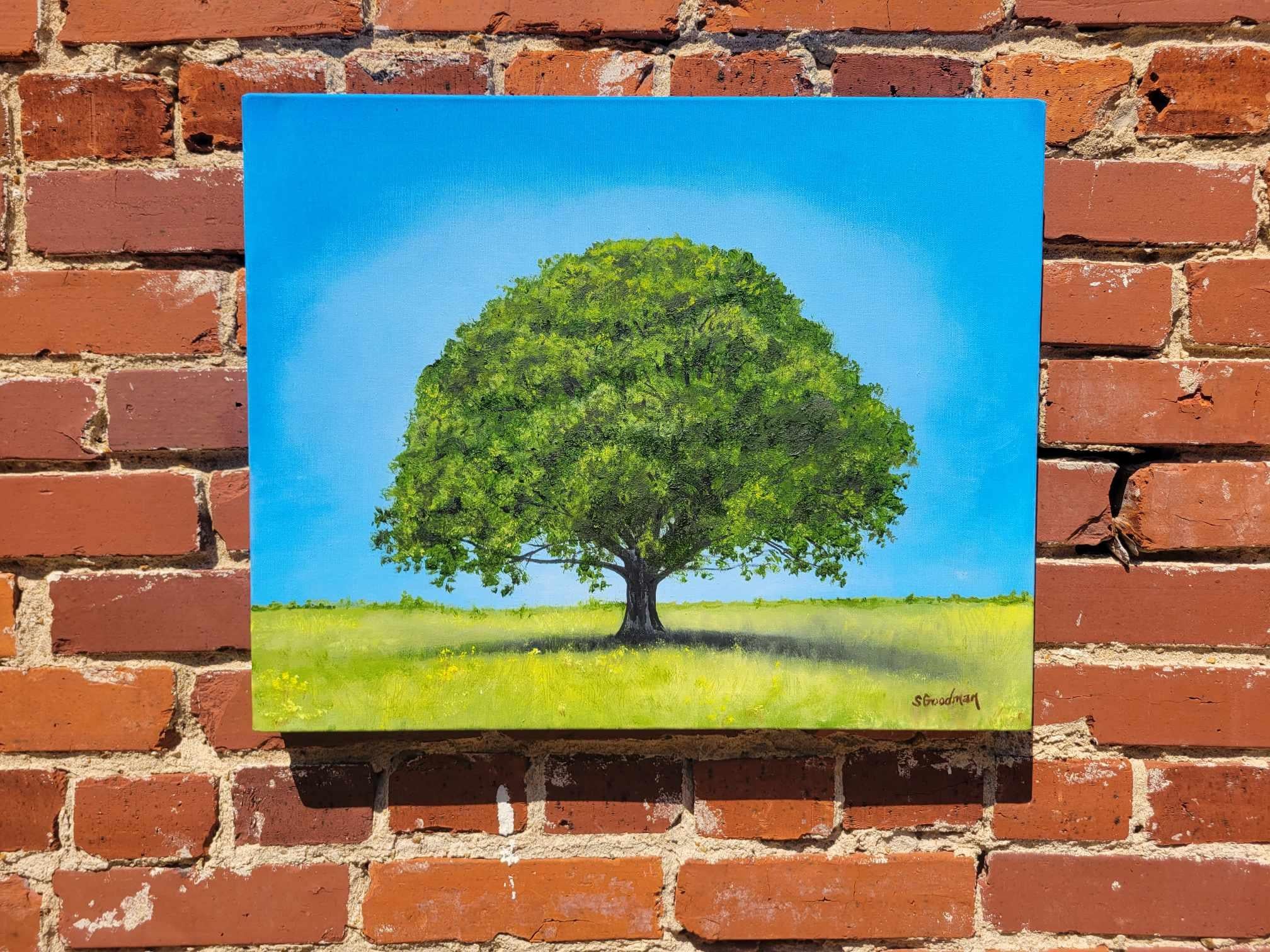<p>Artist Comments<br>Artist Shela Goodman paints a lone oak tree standing majestically in an open sunlit field. 