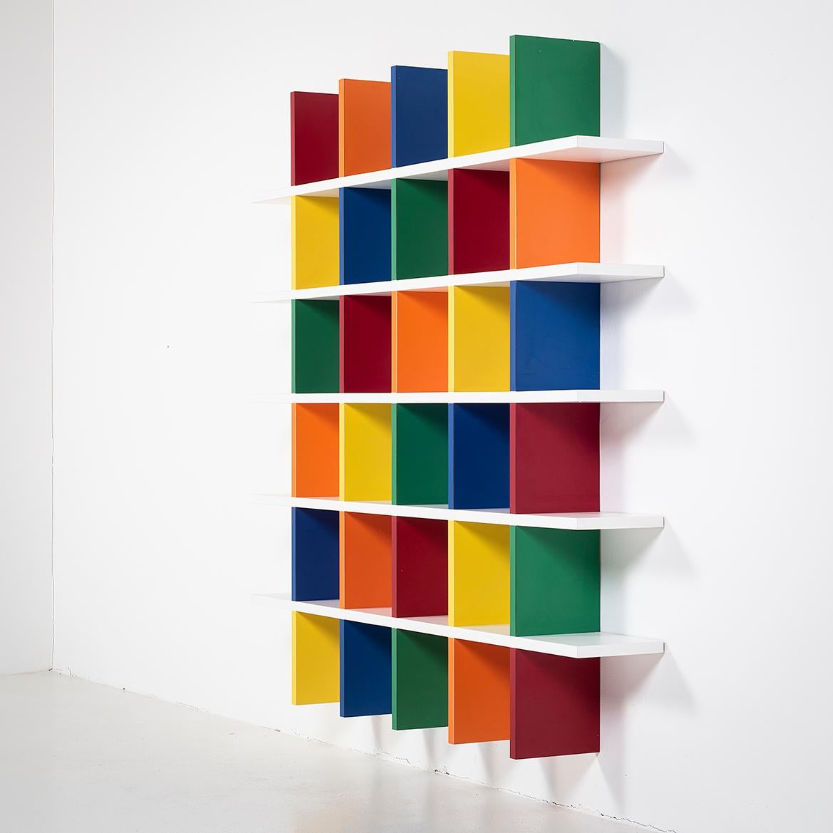 Designed by Shigery Uchida in 2000, SHELF 01 was part of a series shown in a exhibition that toured Tokyo, Nagoy and Sapporo.

As furniture, the design is simple, yet colors give different expressions.  The random arrangement of colors serves as a