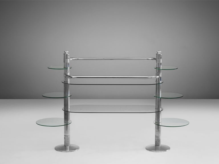 Morari, free-standing display unit, chrome and glass, France, 1960s

A functional and aesthetically pleasing shelving unit. This is discernible in the playful composition of different sized glass plates, resulting in an interesting rhythmic front.