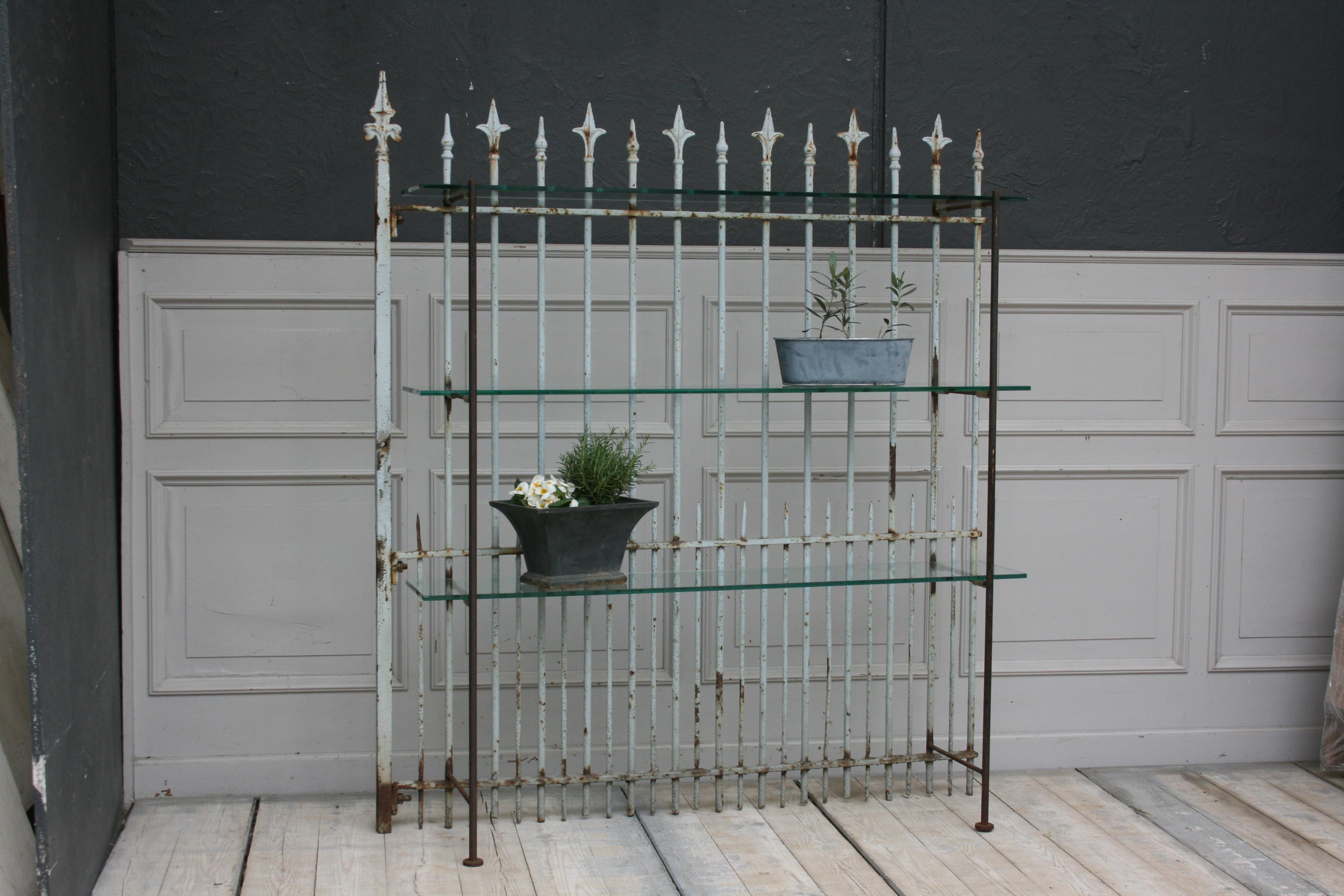 Unique shelf made of original old fence part with glass shelves. Ideal e.g. for garden and terrace.

Dimensions: 
159 cm high, / 62,59 inch
139 cm wide, / 54,72 inch
31 cm deep, / 12,2 inch.