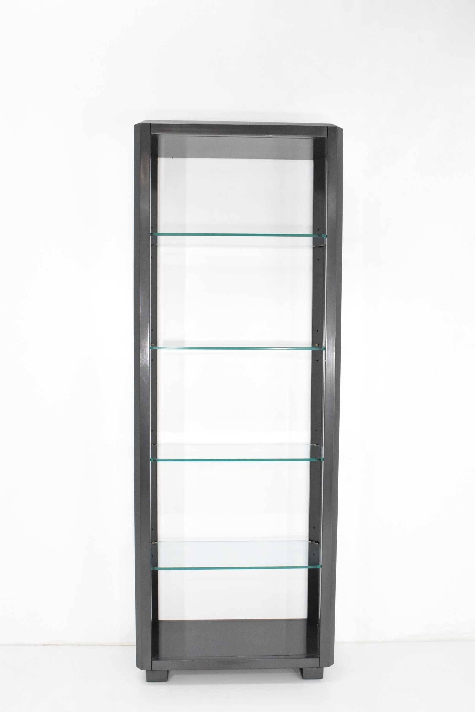 This is a beautifully simple group of four shelf units or bookcases. They date to the 1980s and are available individually. Units have adjustable shelves and 3/8 