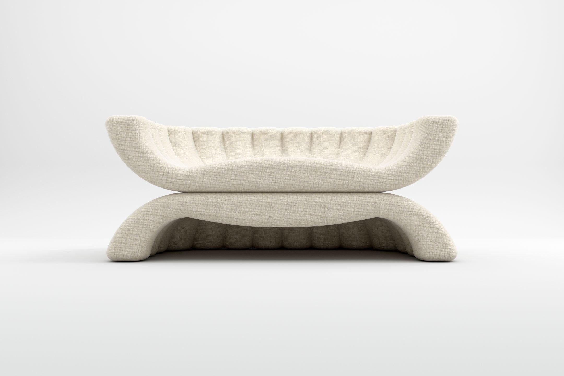 Crafted with the most exquisite fabrics, the embracing curves of the Shell collection draw a sense of warmth and comfort into every environment. The piece was designed and manufactured by Prieto Studio, a furniture design studio based in London that