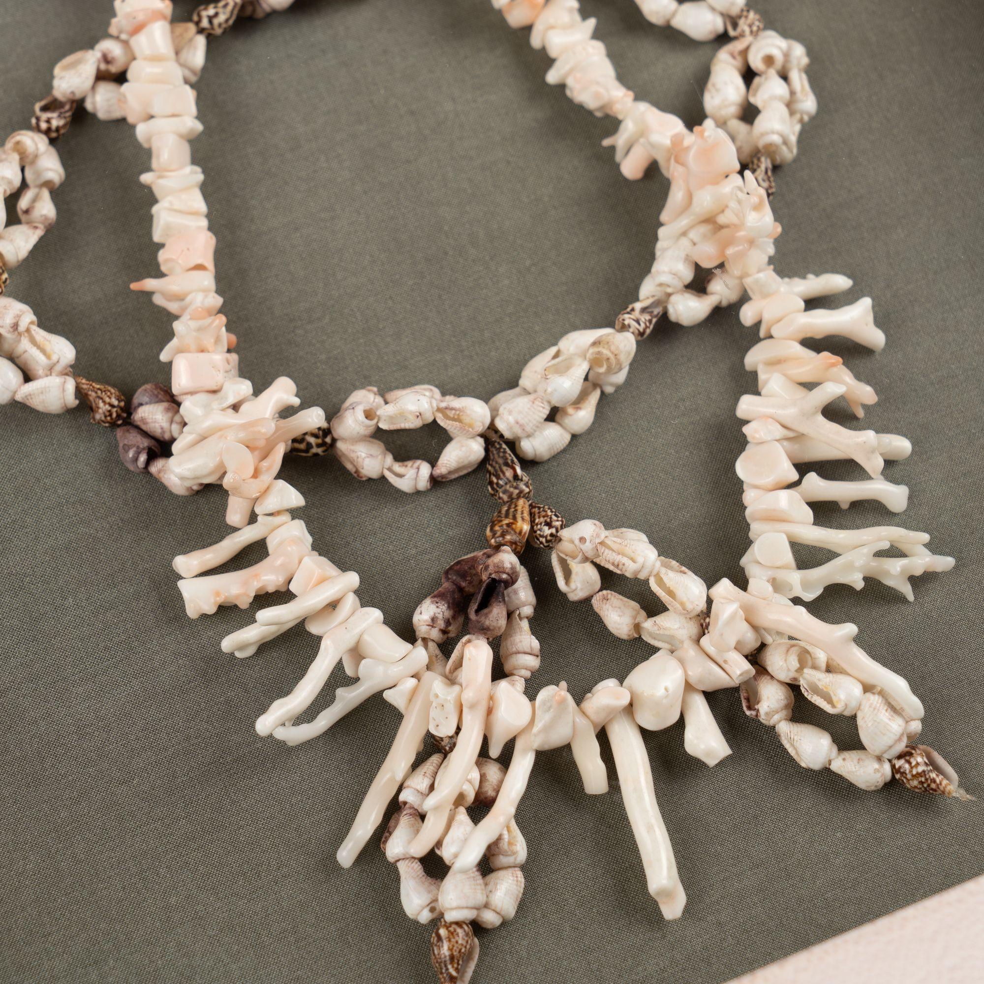 Shell and white branch coral necklaces mounted in a custom shadowbox In Excellent Condition For Sale In Kenilworth, IL