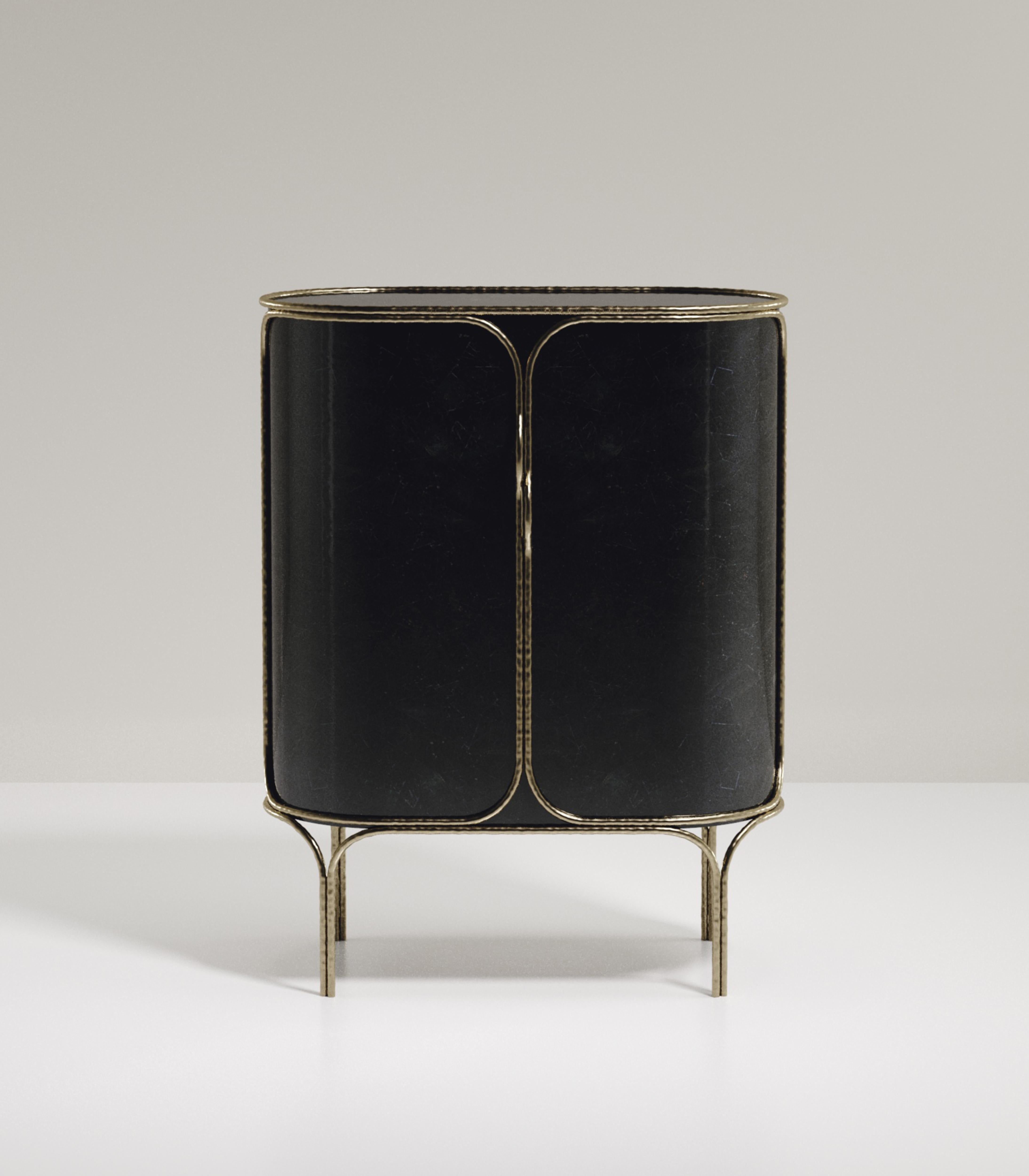 The Arianne bar cabinet by R&Y Augousti is one of a kind statement piece. The overall piece is inlaid in black pen shell accentuated with intricate bronze-patina brass details that have the signature Augousti 