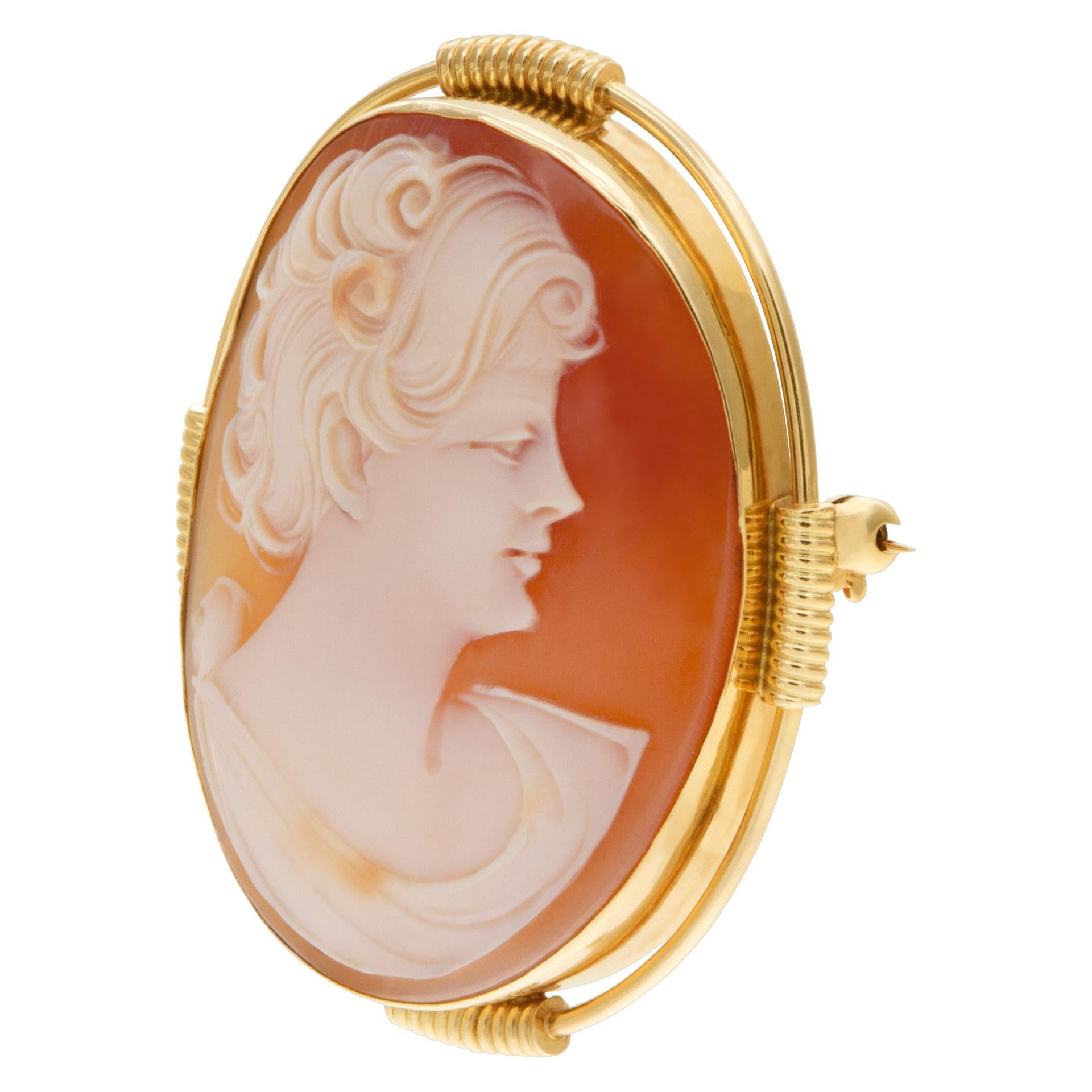 Shell Cameo pin/pendant portrait of a short hair lady set in 14k yellow gold, 39.5mm length x 32mm width.
