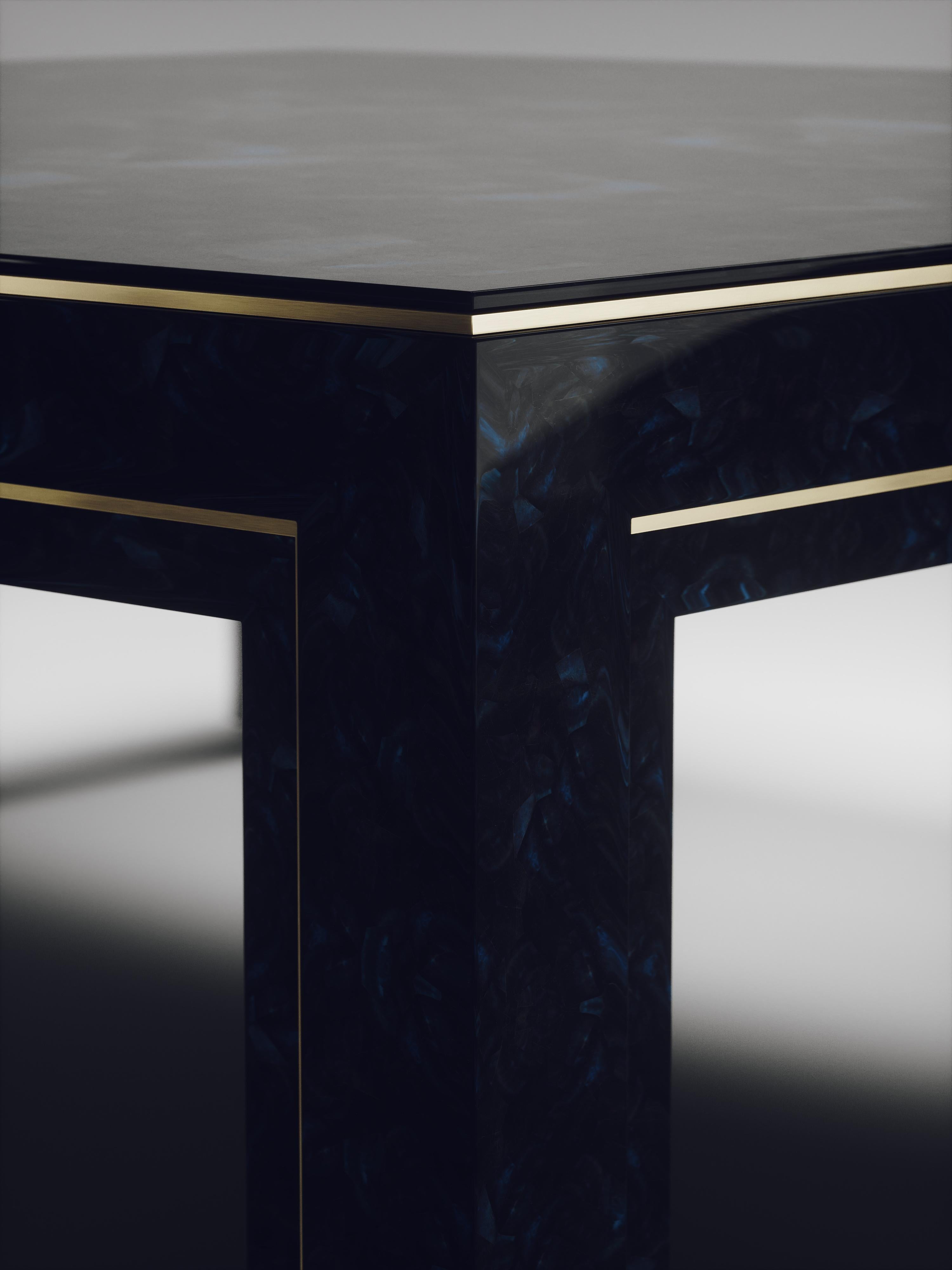 The parsons coffee table by R&Y Augousti is classic and elegant staple piece for your home. The clean lines of the overall piece, inlaid in blue pen shell, are accentuated by the discreet bronze-patina brass indentation detail giving it a luxurious