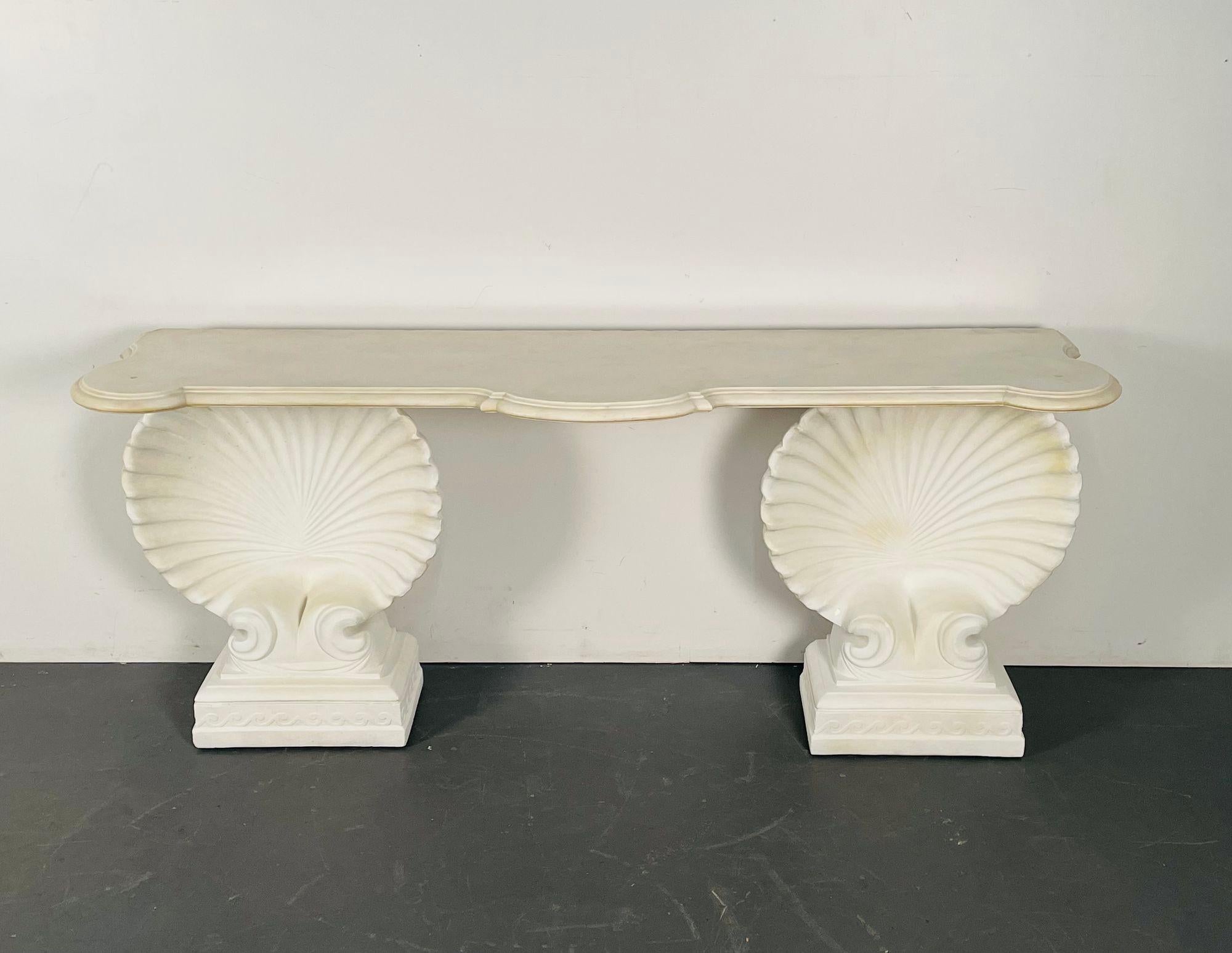 Shell console table, marble, stone, Early 20th Century, Custom Made.

A pair of large shell form pedestals having square carved bases supporting a large serpentine Carrara white marble top with a deep scalloped edge. An impressive piece that can be
