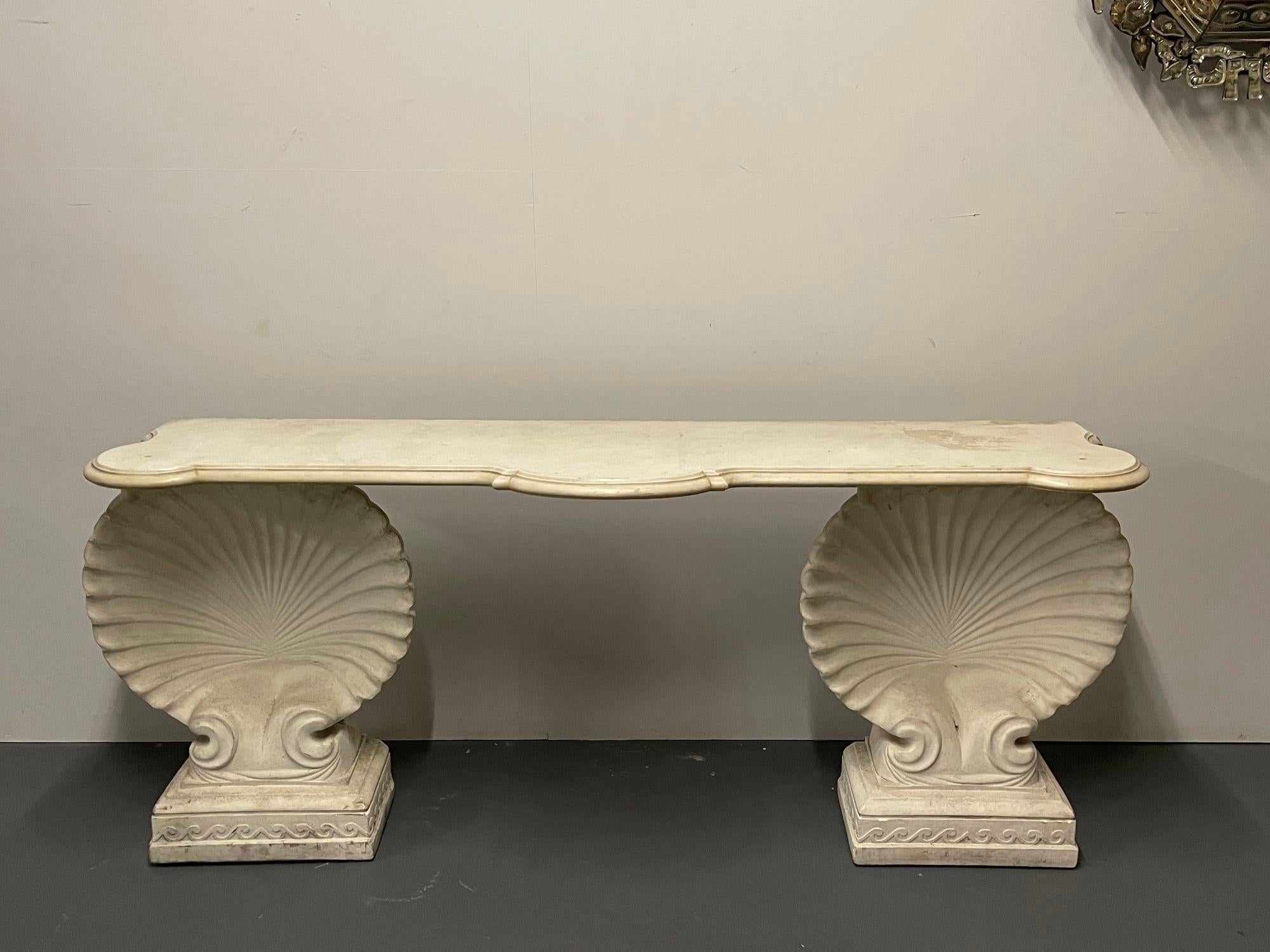 Shell console table, marble, stone, Early 20th Century, Custom Made.

A pair of large shell form pedestals having square carved bases supporting a large serpentine Carrara white marble top with a deep scalloped edge. An impressive piece that can