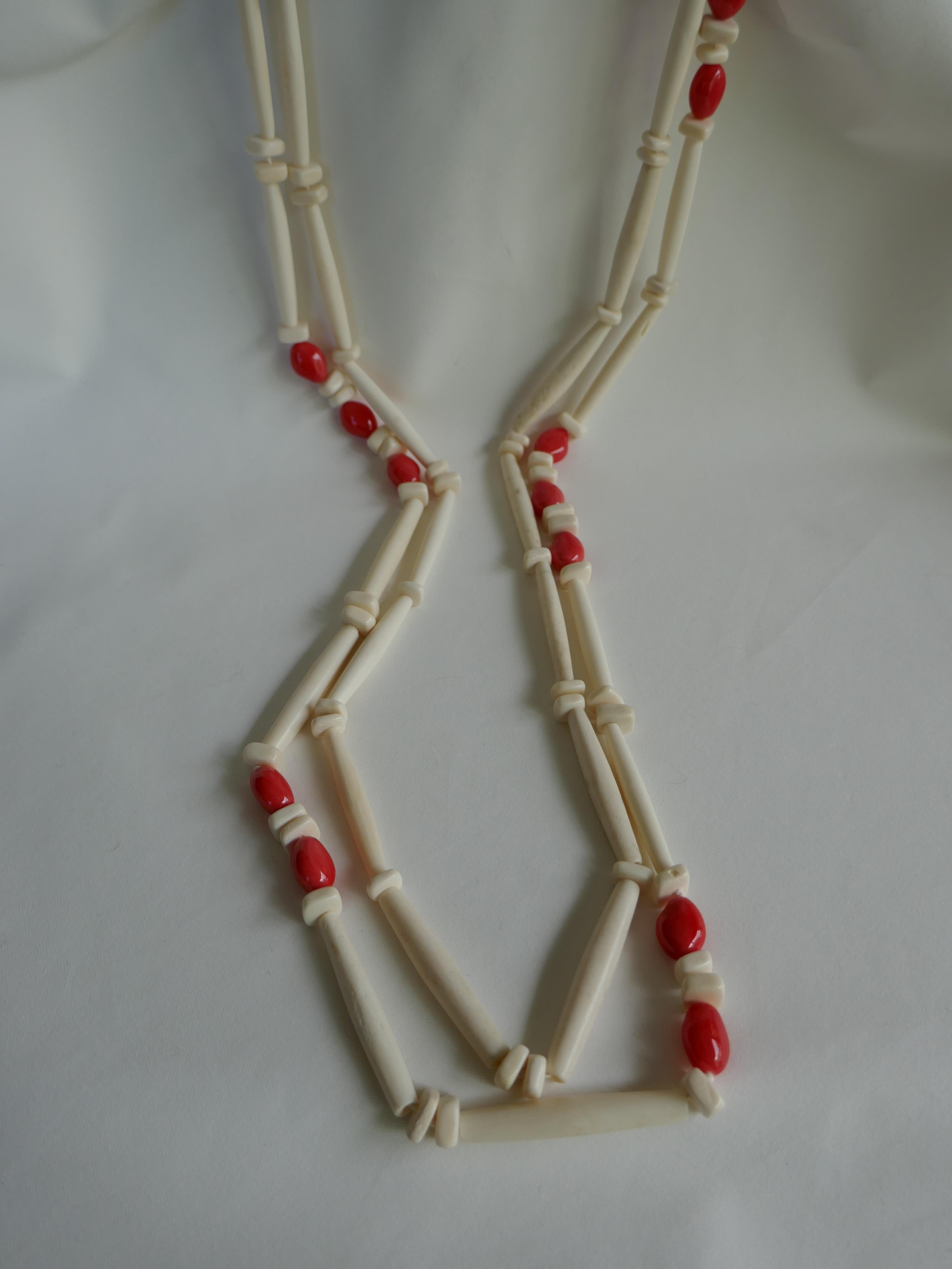 If you like unique pieces this is definitely one to own. This two strand necklace combines shell coral nuggets  with two shapes of bleached horn. The clasp is macramé and Rock Crystal Nuggets. The necklaces are individual necklaces that may be worn