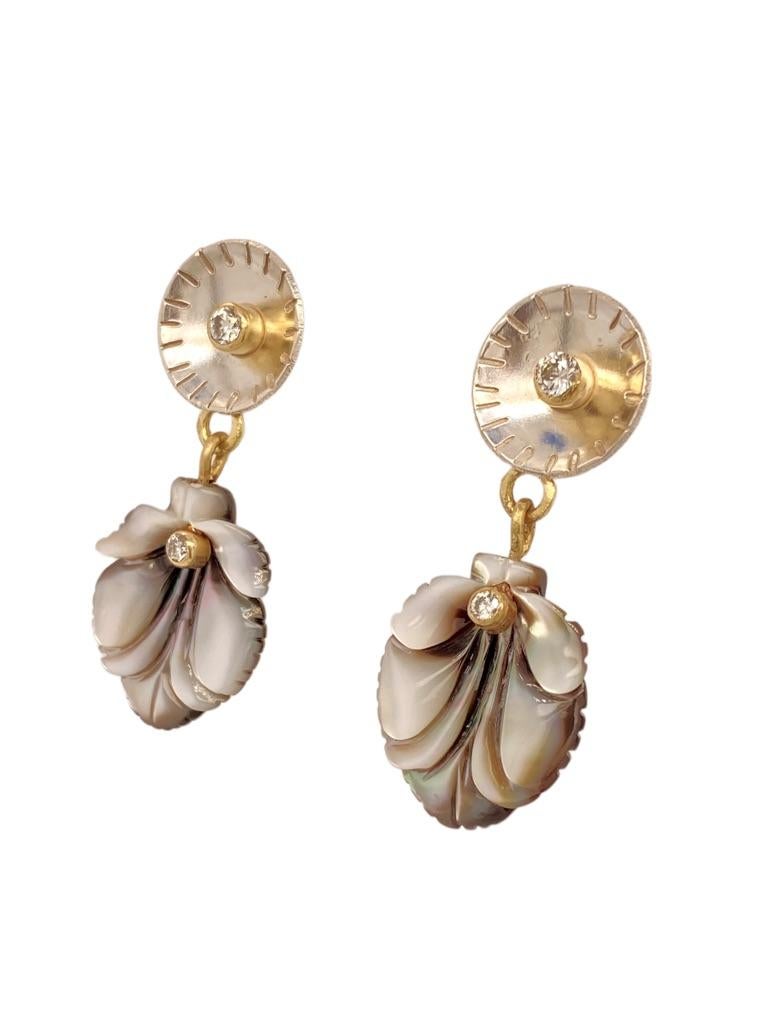  Shell earrings in a drop style with sterling silver, 18k settings for two  .10ct diamonds and two .03 ct diamonds and black lip mussel shell.
Inspired by my recent sailing travels.
“The purpose of jewelry is not just for adornment. There’s