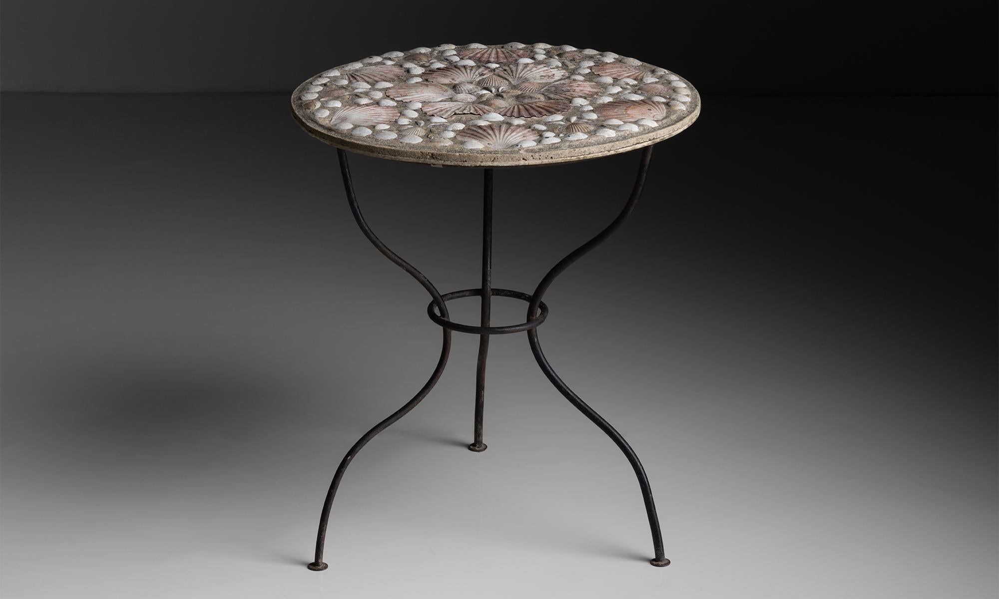 Shell Garden Table

England, circa 1950

Cement top with inset shells on iron base.

23.75”dia x 27.25”h