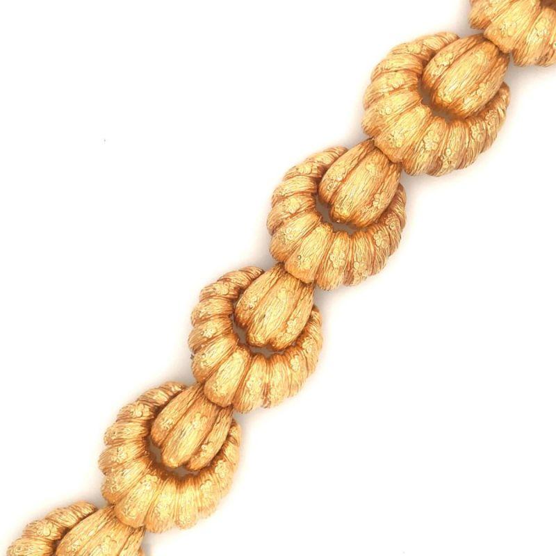 One shell-like link 18K rose gold bracelet featuring 6 large shell-like links with a heavily textured gold finish and rich gold tone. Circa 1960s.

Grandiose, lovely, statement.

Additional information:
Metal: 18K rose gold
Circa: