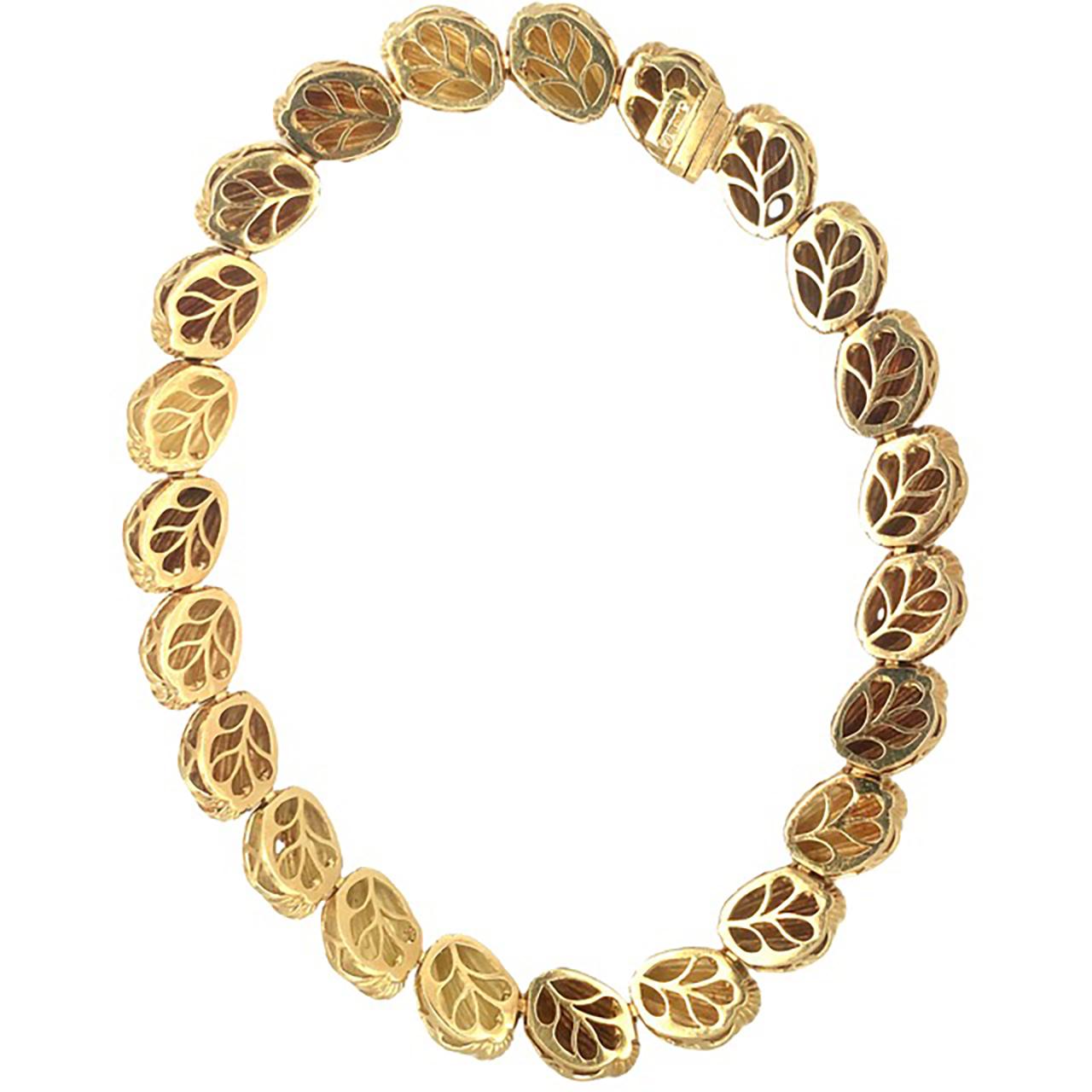 One shell motif link 18k yellow gold necklace by Hammerman Brothers featuring twenty-three ribbed and high polish gold links measuring 15 mm. wide and 12 mm. tall. Circa 1960s.

Impressive, gleaming, weighty.

Metal: 18K yellow gold
Circa: