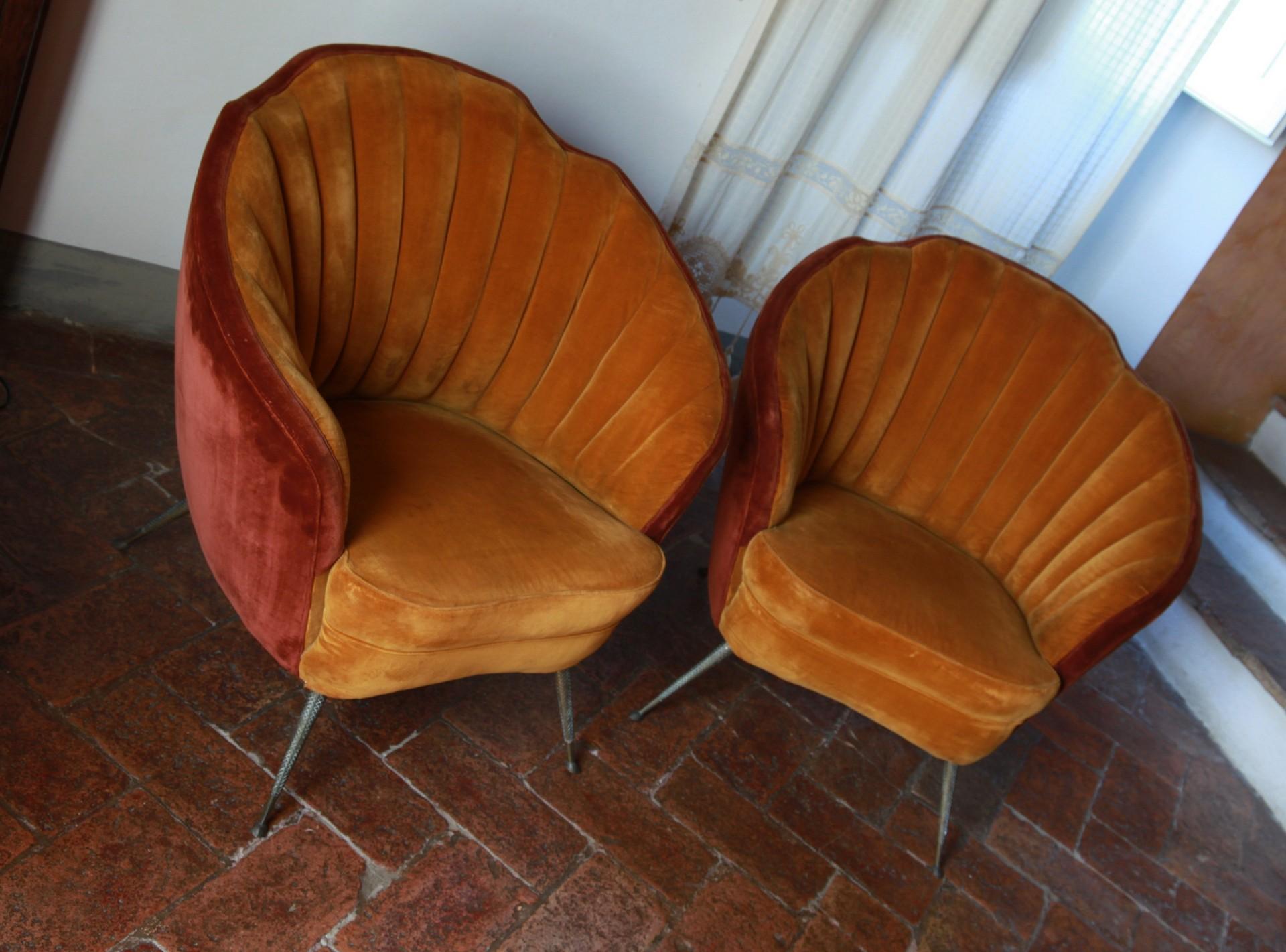 Two charming shell armchairs. The chairs have an incredible care for details. 
Brass legs are in casting fusion and are probably made to represent fish or reptile skin. 
The quality of stitching and curves on the back are indicating a Brianza