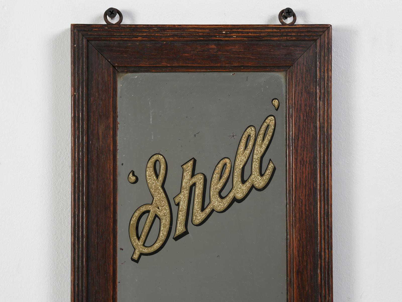 Very rare to find, a circa 1930s mirror in this condition, let alone an English Shell Oil Company, factory supplied advertising mirror. There were initially (4) different styles of the Shell Oil Company mirrors available, in the same size and this