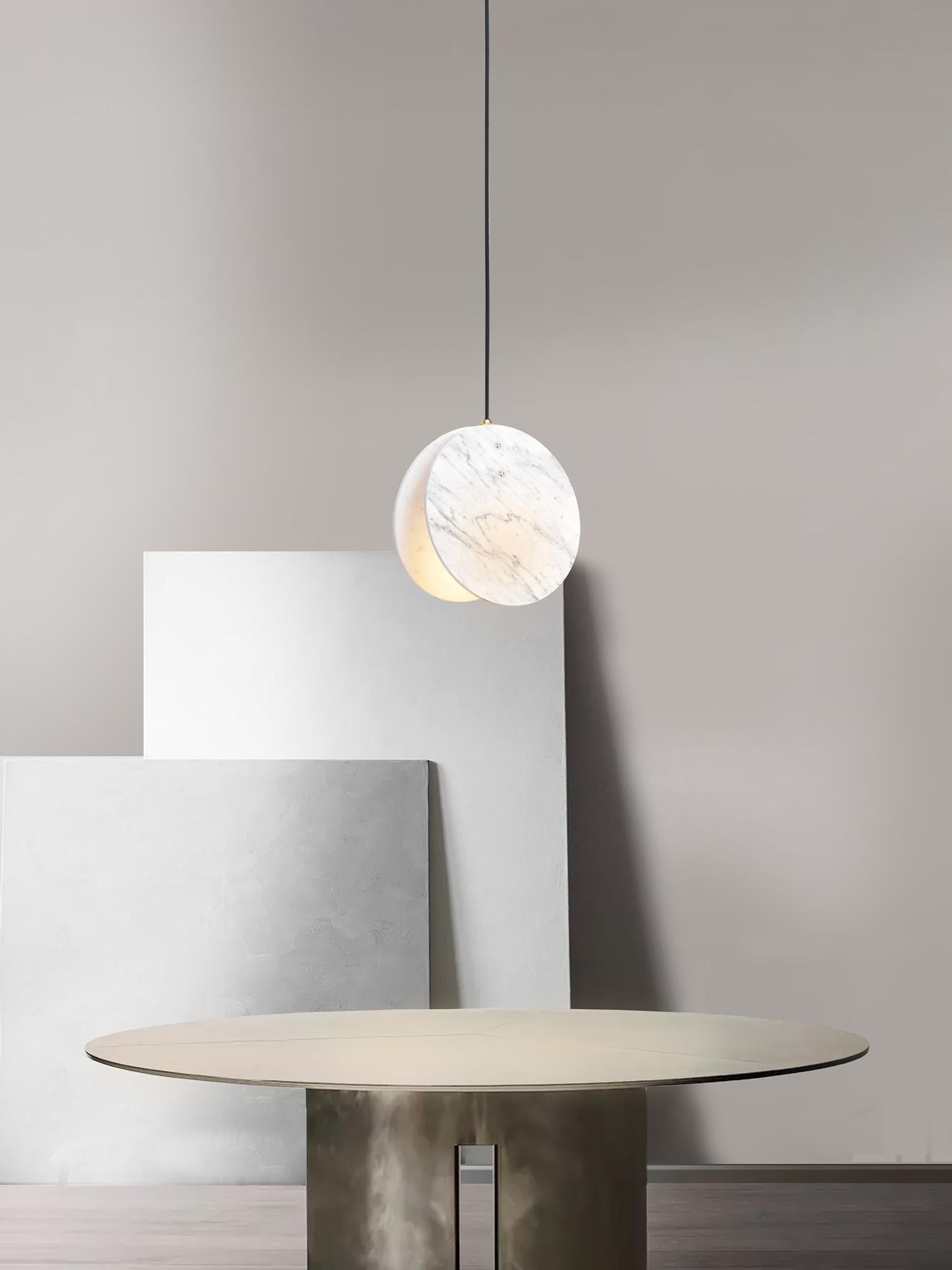 Inspired by our love for the British coastline and beaches. Made from a solid brass lamp housing, enclosed in two Carrara marble discs to create a soft, directional light source.

Lamp - GU10 (spotlight)