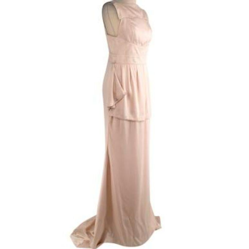 Givenchy shell pink silk-satin apron gown
 
 - Pale shell pink heavyweight silk-satin
 - High neck, apron-style cut with low back, and playfully exaggerated hip flounce
 - Column skirt with train 
 - Fully lined in silk 
 
 Materials 
 100% Silk 
 
