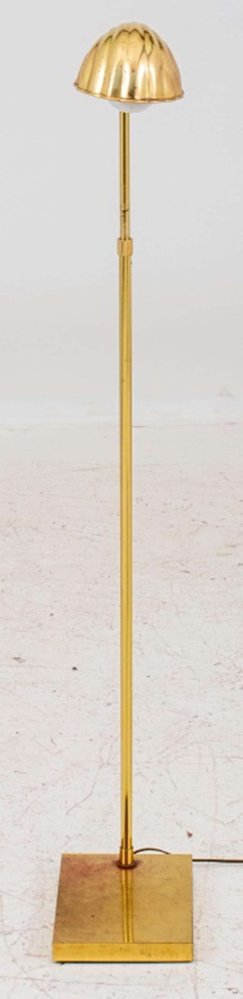 Brass extendable floor lamp with a shell-shaped shade on a square base, unmarked. Measures: 49