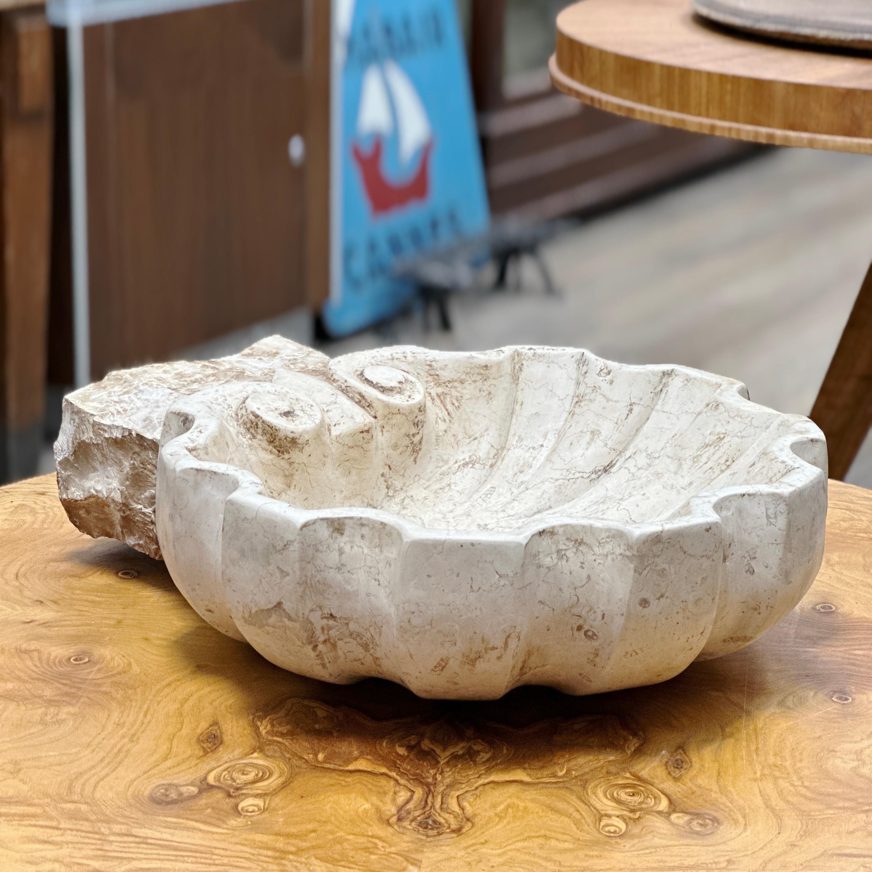 Here is a beautiful Shell Shaped Italian Marble Holy Water Stoup. Made completely by hand, this holy water stoup is made from a single block of Italian marble. It can be used as a fountain basin, a holder for keys, jewelry etc…or as an interior