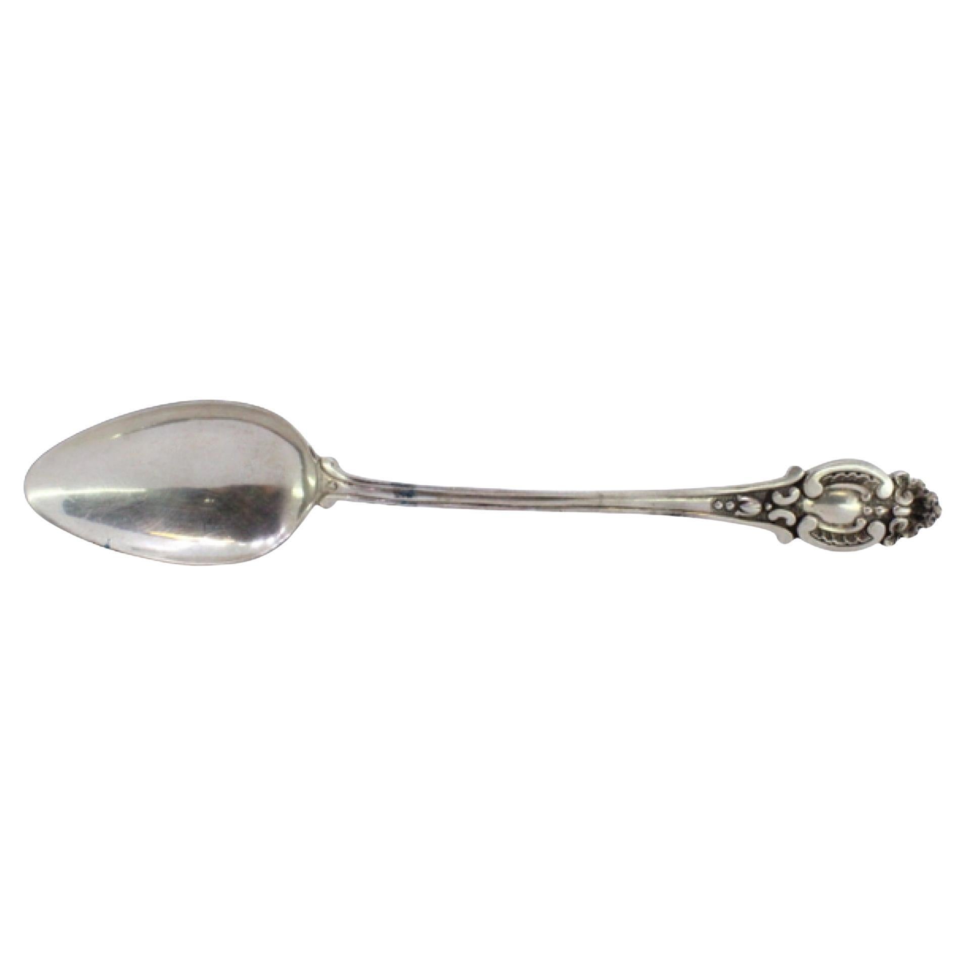 Shell-shaped silver rice/serving spoon with reliefs and grooved handle
