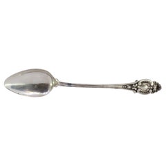 Shell-shaped silver rice/serving spoon with reliefs and grooved handle