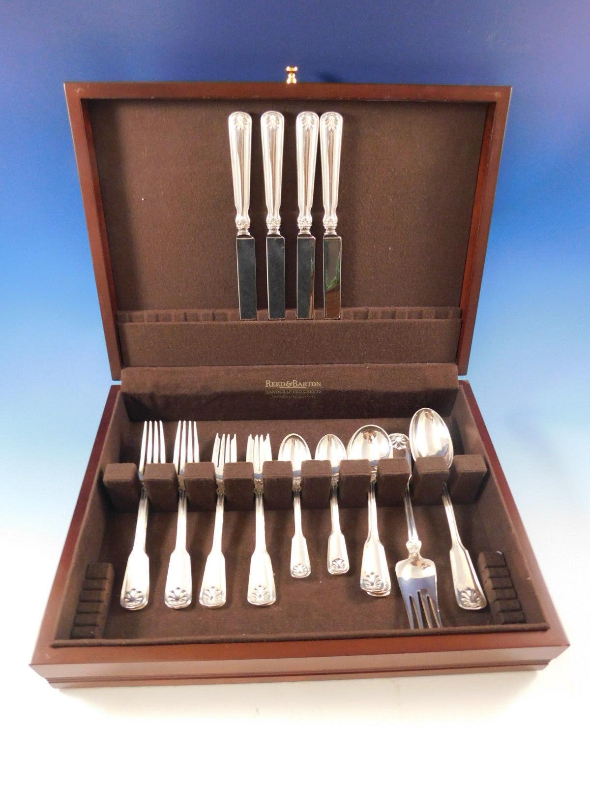 Dinner size shell and thread by Tiffany & Co. sterling silver flatware set - 22 pieces. Great starter set! This set includes:

4 dinner size knives, 10 1/4