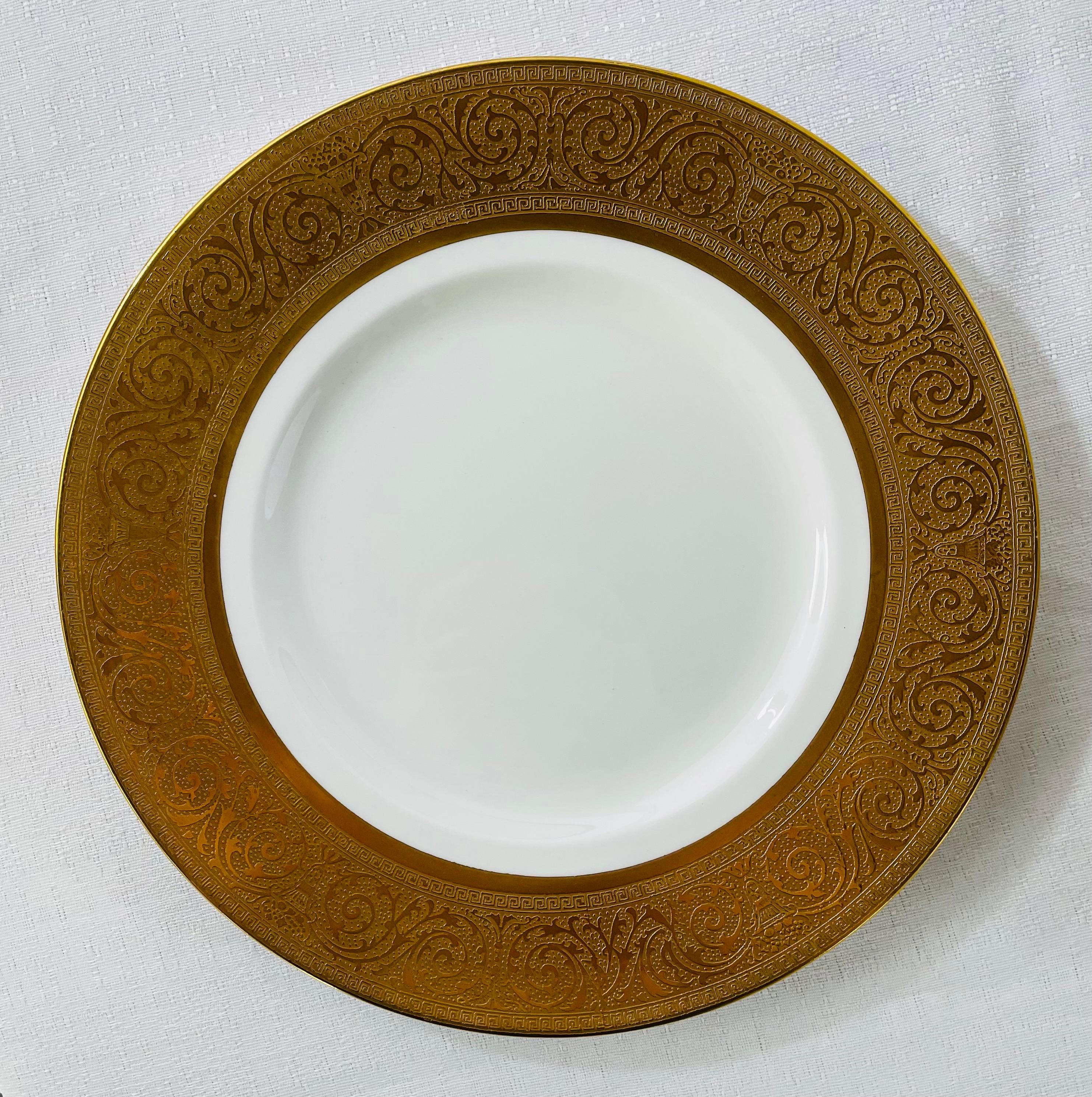 A set of 12 Shelley dining plates with gold trim and beautiful design. Each plate is stamped in the back. 
Dimensions: 11