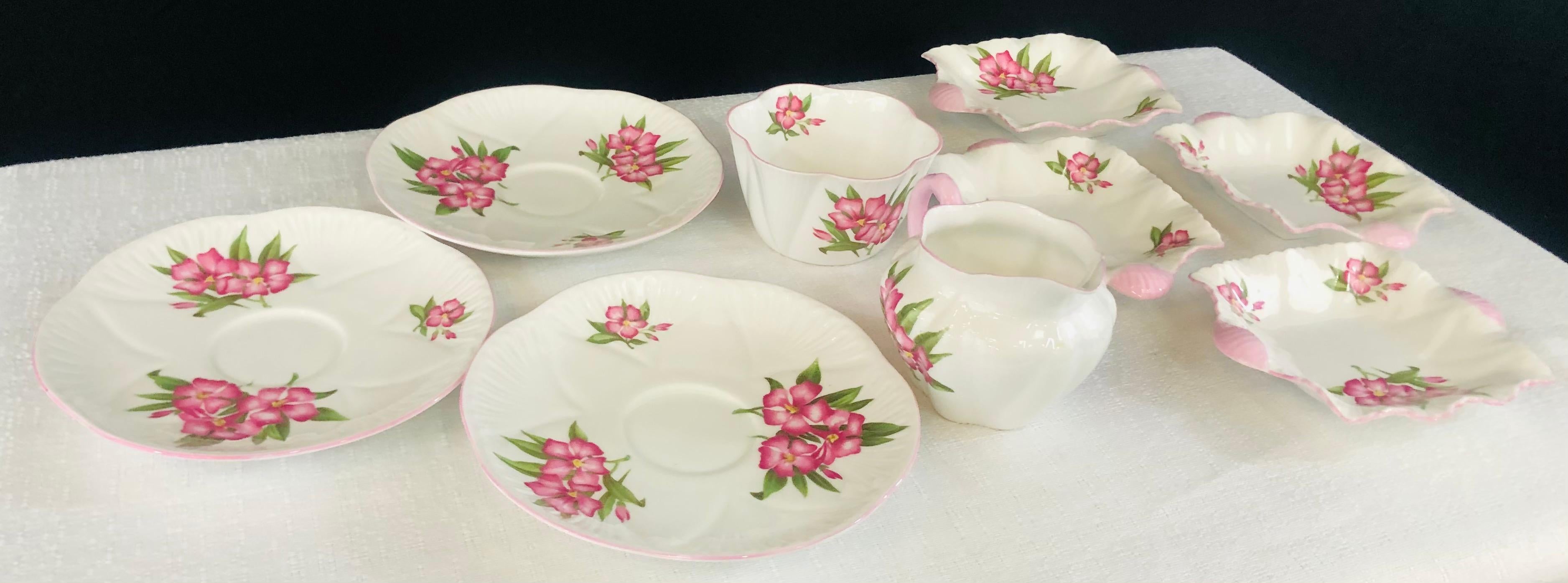 An Art Deco Shelley serving tea time set with 8 pieces in good condition. The porcelain pieces features beautiful flowers designs.

Biggest plate 6