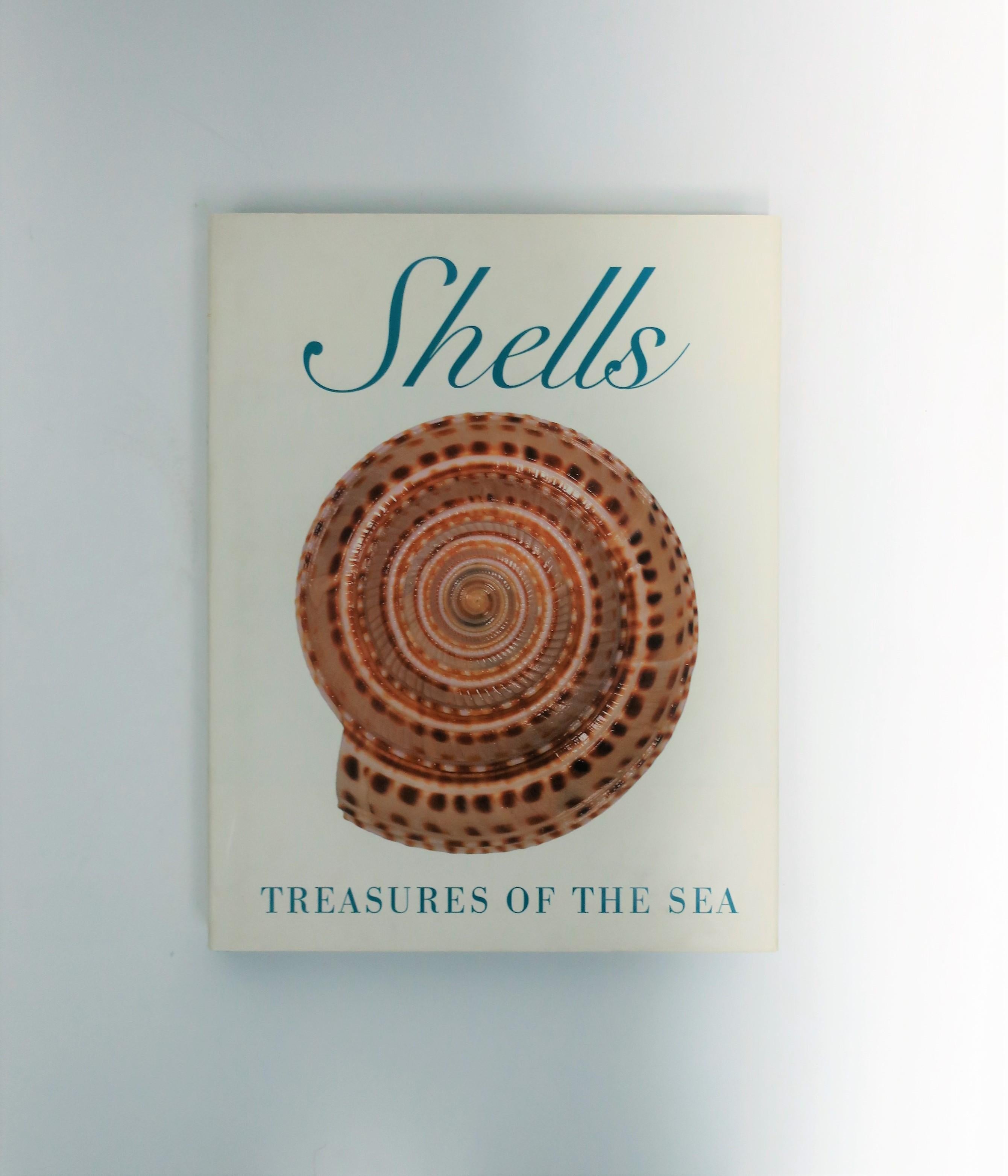 Beautiful vintage coffee table book, shells: 'Treasures of the Sea', circa 1990s. Shells: 'Treasures of the Sea' is an incredible book, beautifully done, and informative. This coffee table or library book is dedicated to the history of the shell