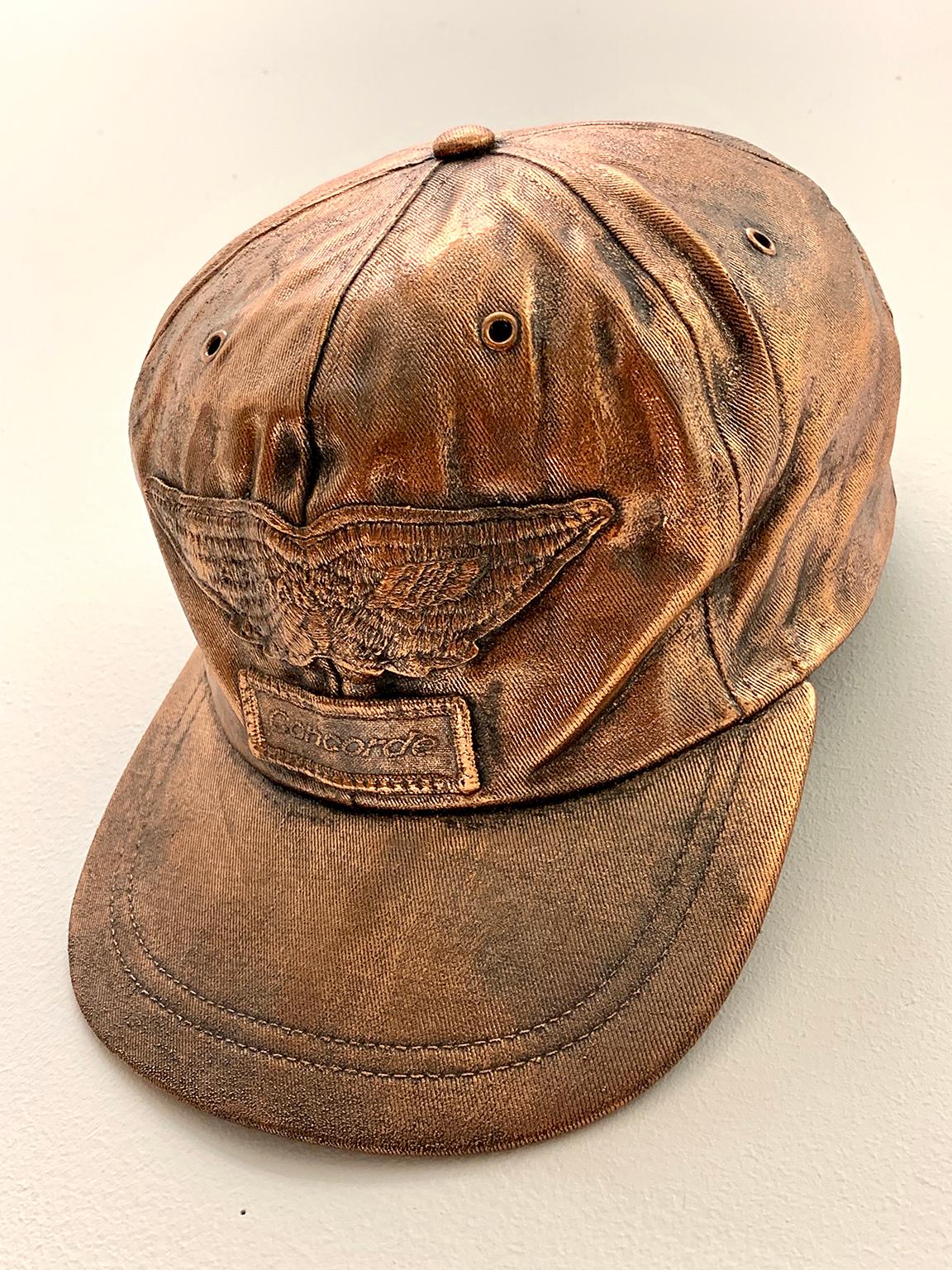 Concorde Cap
Shelter Serra
5.5”x7”x9” 
Electroplated Copper 
2017

The Concorde Cap is one of an ongoing series of copper electroplated hats. Ranging from Superman to Nascar, the artist chooses hats from all walks of life before distilling through