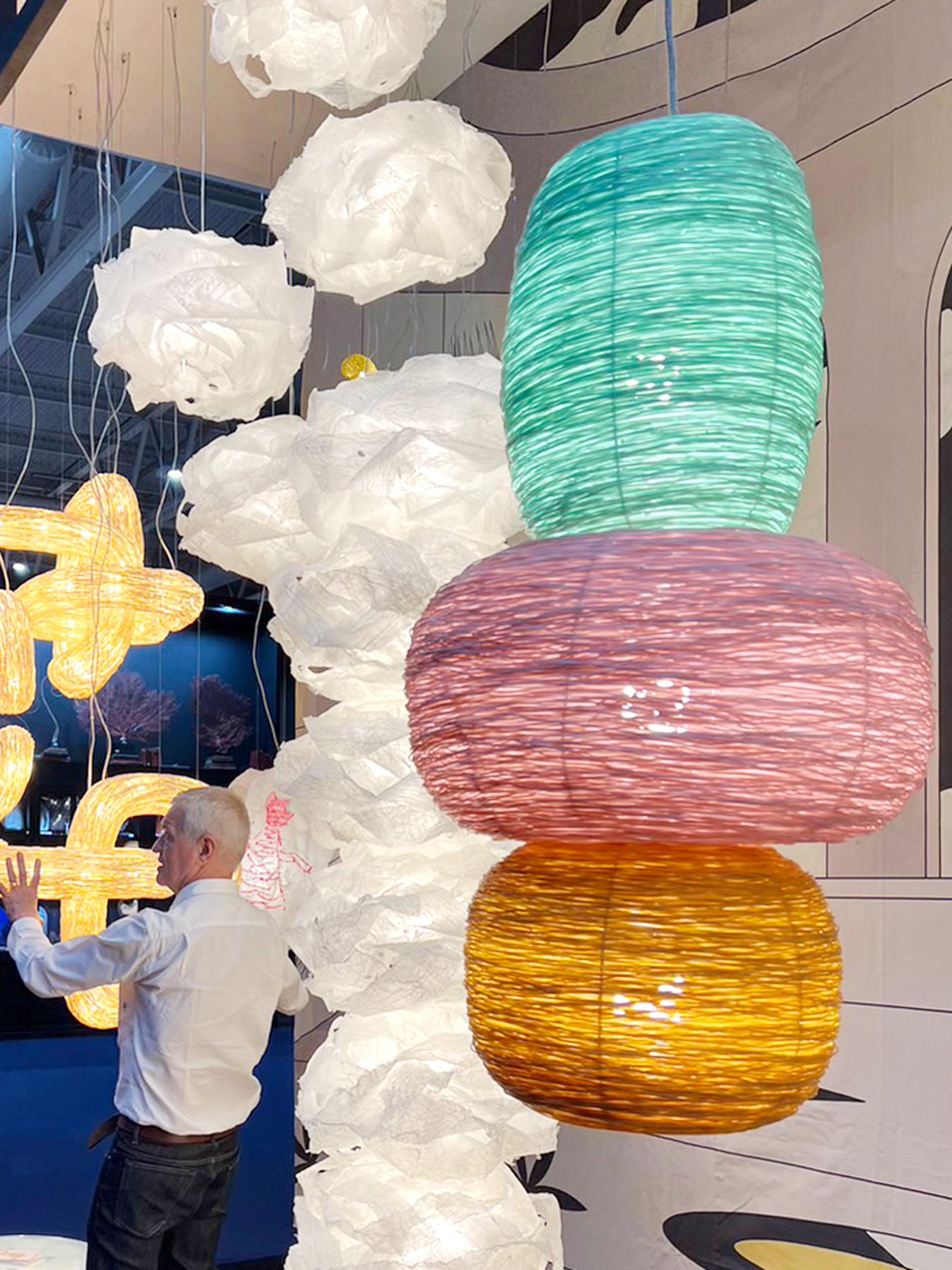 Each Shelter pendant is created with the elemental and universal form of a loosely woven nest like home, that is then incarnated by light inside, diffused through many metres of lateral recycled plastic waste material . 

The Shelter pendant