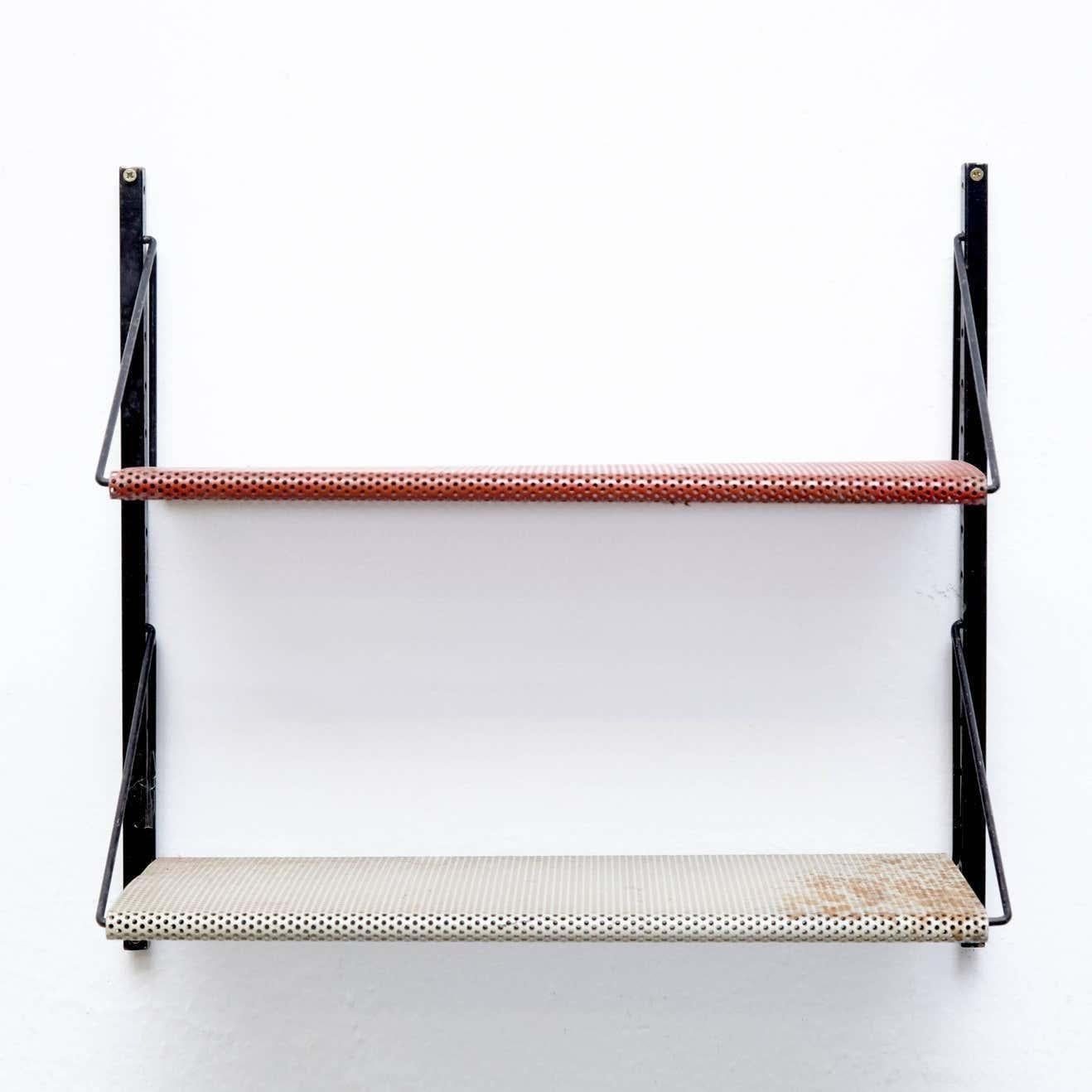 Shelves in the style of Mathieu Matégot  Manufactured in France, circa 1950.    In good condition, with minor wear consistent with age and use, preserving a beautiful patina.    Mathieu Matégot (1910-2001) was a Hungarian and French designer and