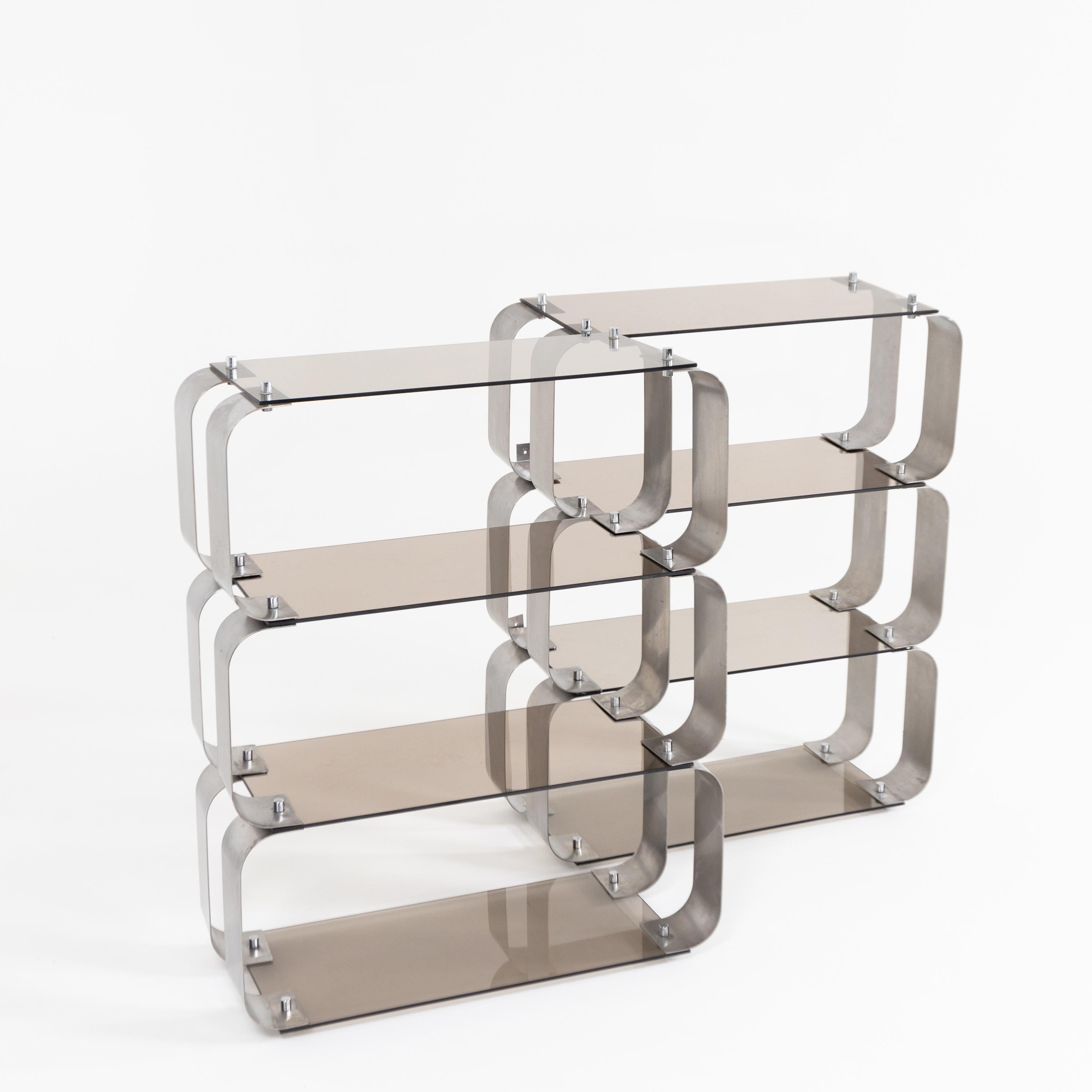 Pair of shelves with c-shaped adjustable steel supports and rectangular smoked glass shelves.