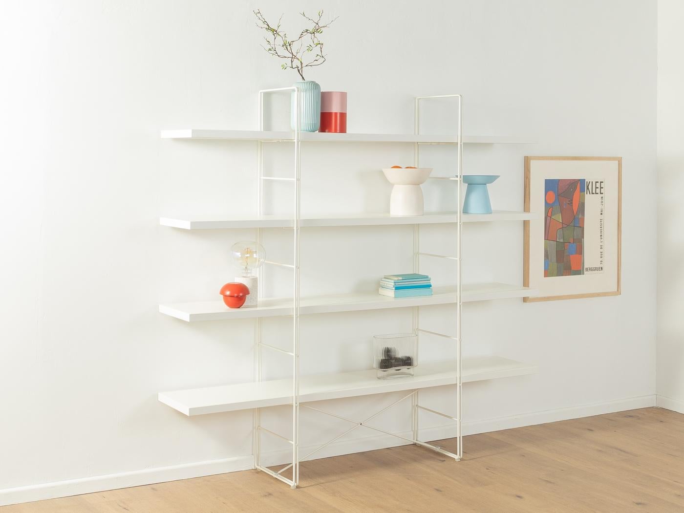 Shelving system ENETRI by Niels Gammelgaard for IKEA from the 2000s. New edition of the GUIDE system from 1985. Powder-coated metal frame in white with four chipboard shelves in white.
Quality Features:

    good workmanship
    high quality