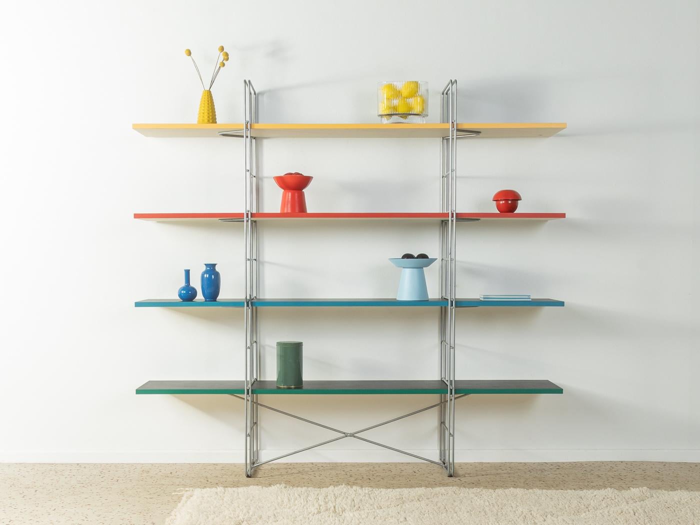 Rare shelving sytem GUIDE by Niels Gammelgaard for IKEA from the 1980s. Powder-coated metal frame in matt grey with four chipboard shelves in black and colored shelf edges.

Quality Features:
 good workmanship
 high quality materials
 Made in