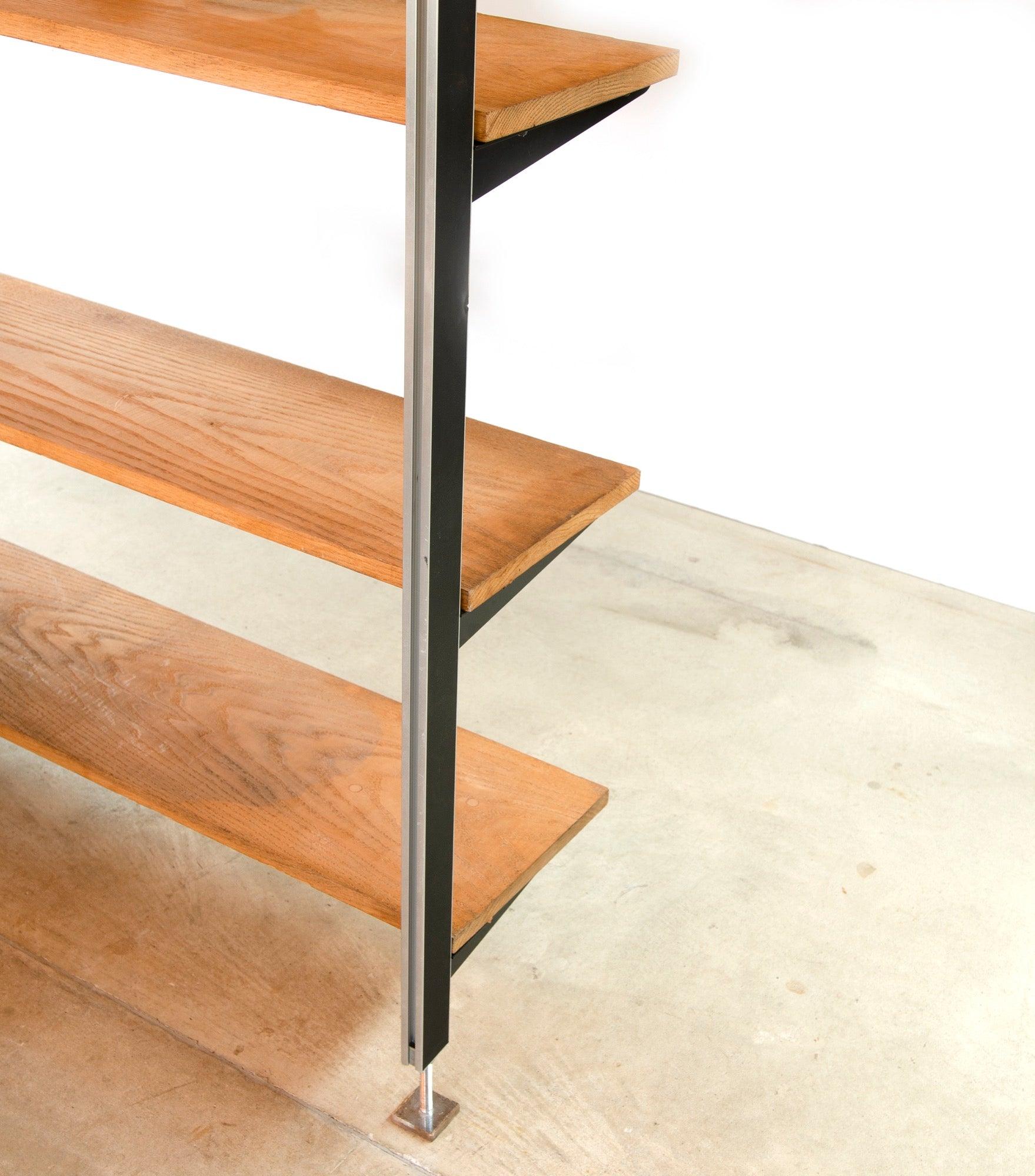 Expansive Four Bay George Nelson â€˜Comprehensive Storage System' (CSS) with customized ash shelving installed by first sale client in the 1970s. Introduced by Herman Miller in 1959, CSS was a refinement on Nelson's slightly earlier â€˜OMNI' storage