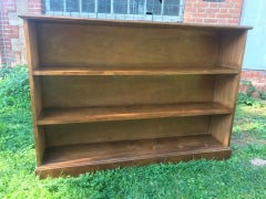 Shelving unit in walnut veneer