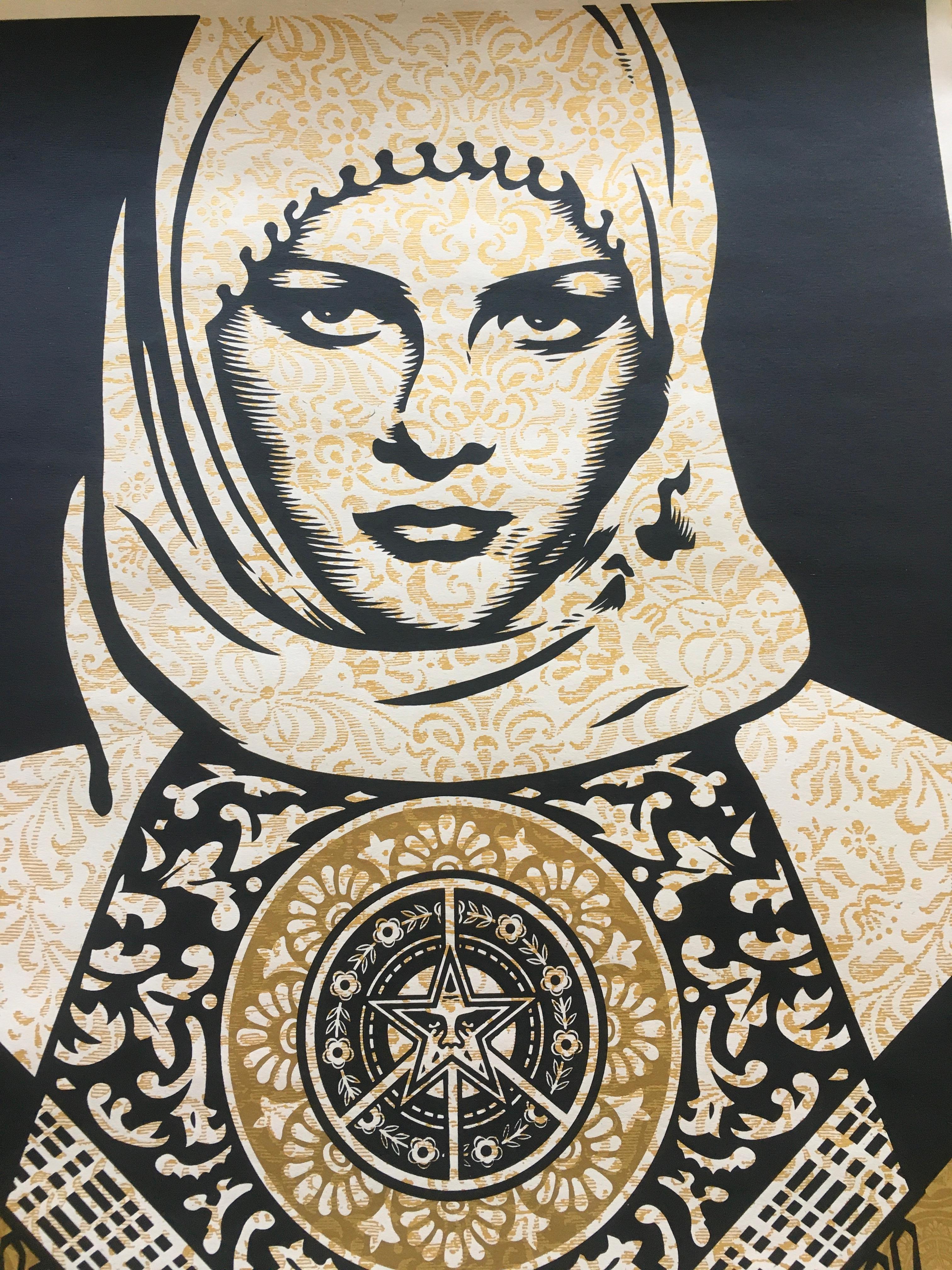 'Arab Woman Gold' by Shepard Fairey, 2007
18 x 24  inches (45 x 61 cm)
Screen Print on  Fine Art Paper.
Limited edition of 300 (AP)
Hand-signed and dated in pencil by Shepard Fairey. Signature and date appear on the bottom right, the number on the
