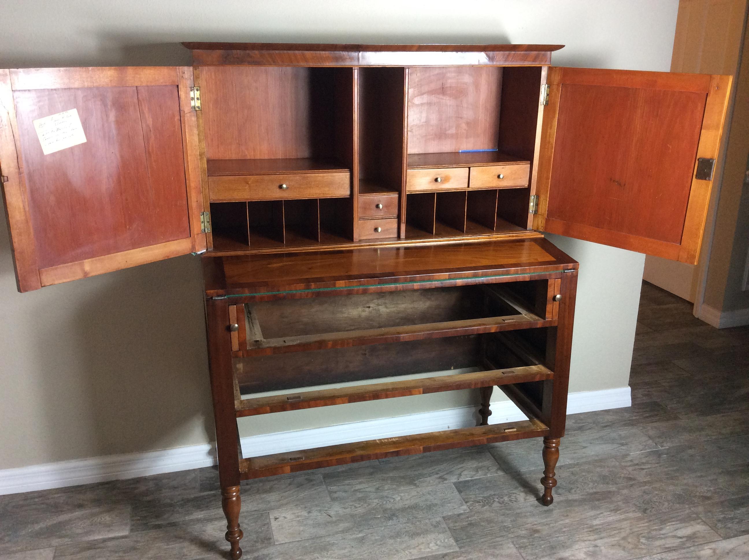 Sheraton  Birch, Cherry and figured Mahogany two piece American bookcase secretary most likely of New England origin possibly New Hampshire around 1830-40.  Very good overall condition retaining an older refinish exhibiting a nice warm aged color