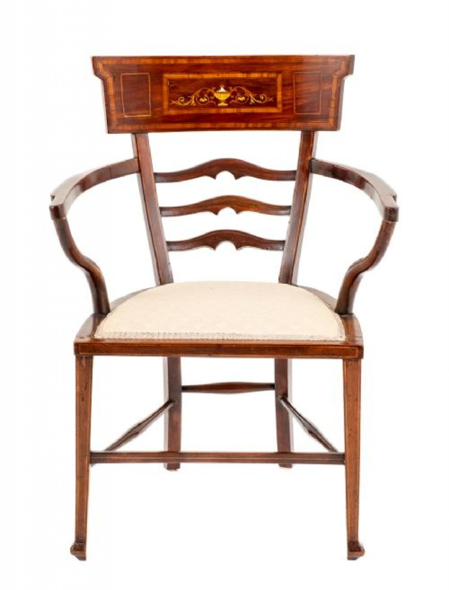 Sheraton Revival Open Arm Chair.
Circa 1890
This Pretty Chair Being of a Rather Unusual Design.
Raised Upon Tapered Front Legs and Swept Back Legs with Turned Stretchers.
The Chair Features Shaped Arm Supports, Shaped Rails and a Deep Top Rail With